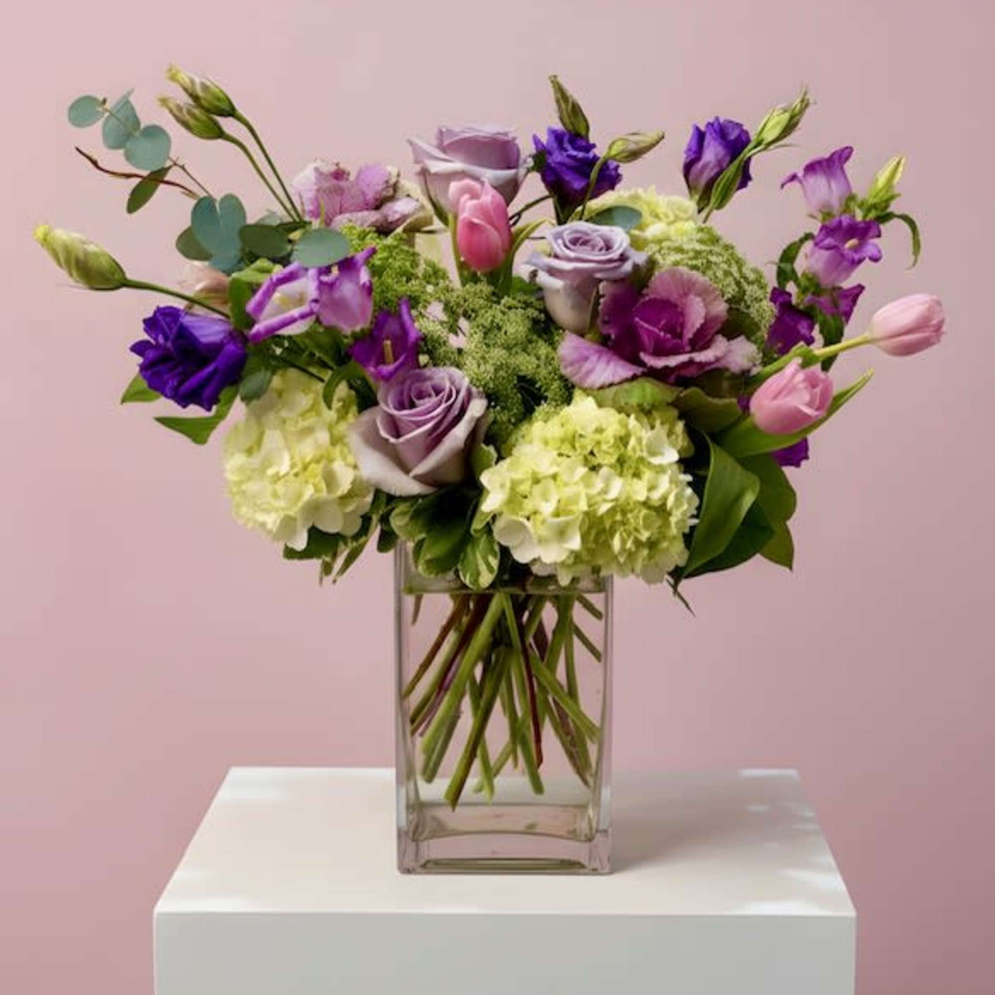 A lush blend of hydrangeas, lisianthus, roses, and seasonal blooms, thoughtfully arranged