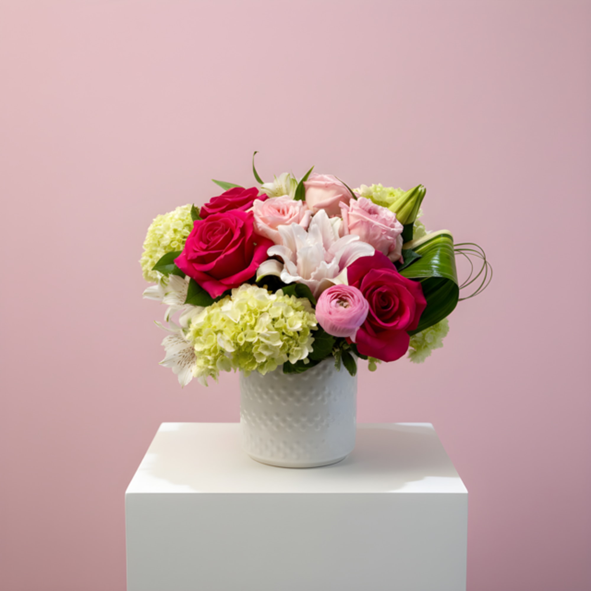 A curated mix of soft and bold pink blooms, artfully arranged to