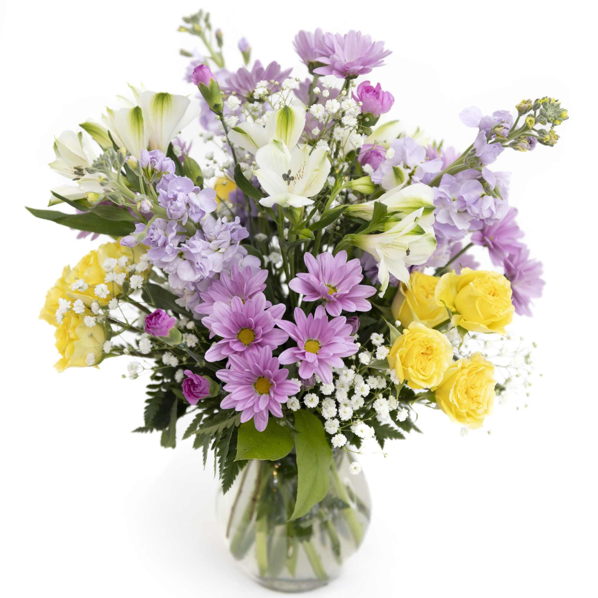 Garden Glow is a cheerful, garden-inspired arrangement bursting with fresh spring color.