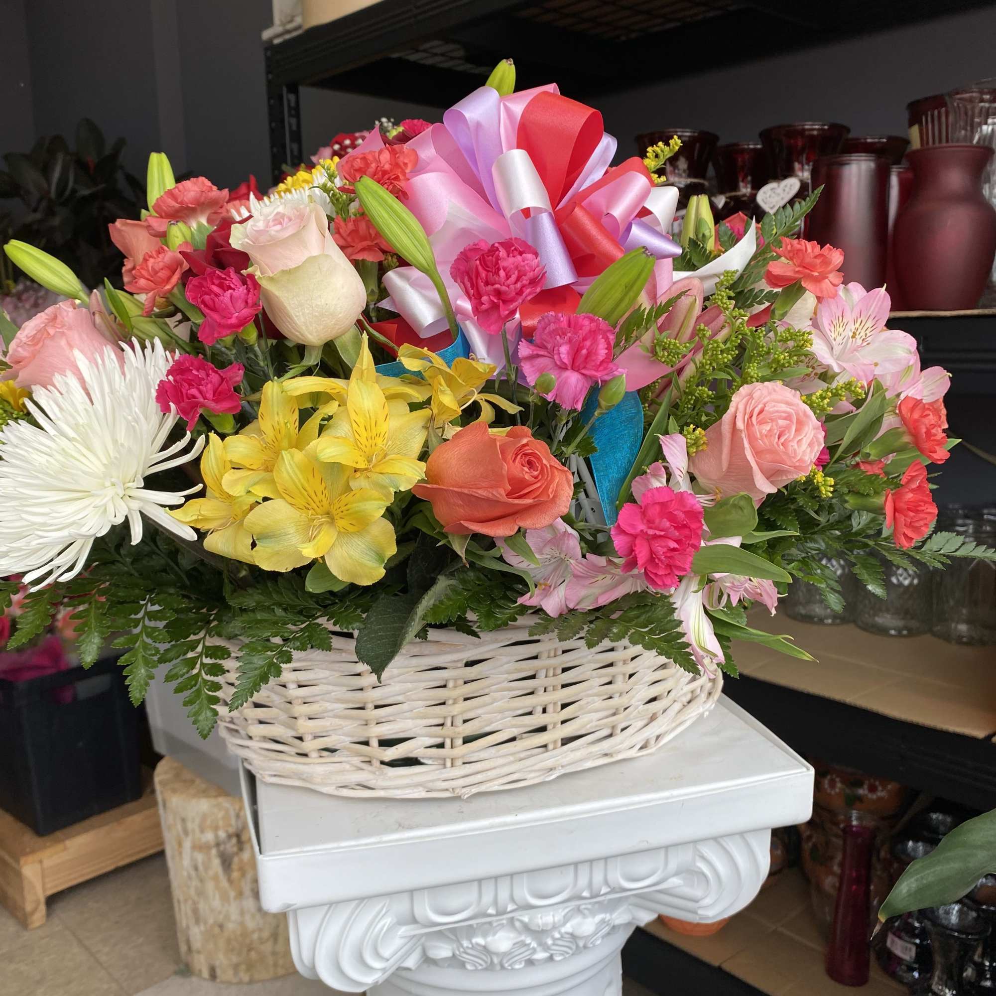 The basket includes a variety of mixed colors and flowers