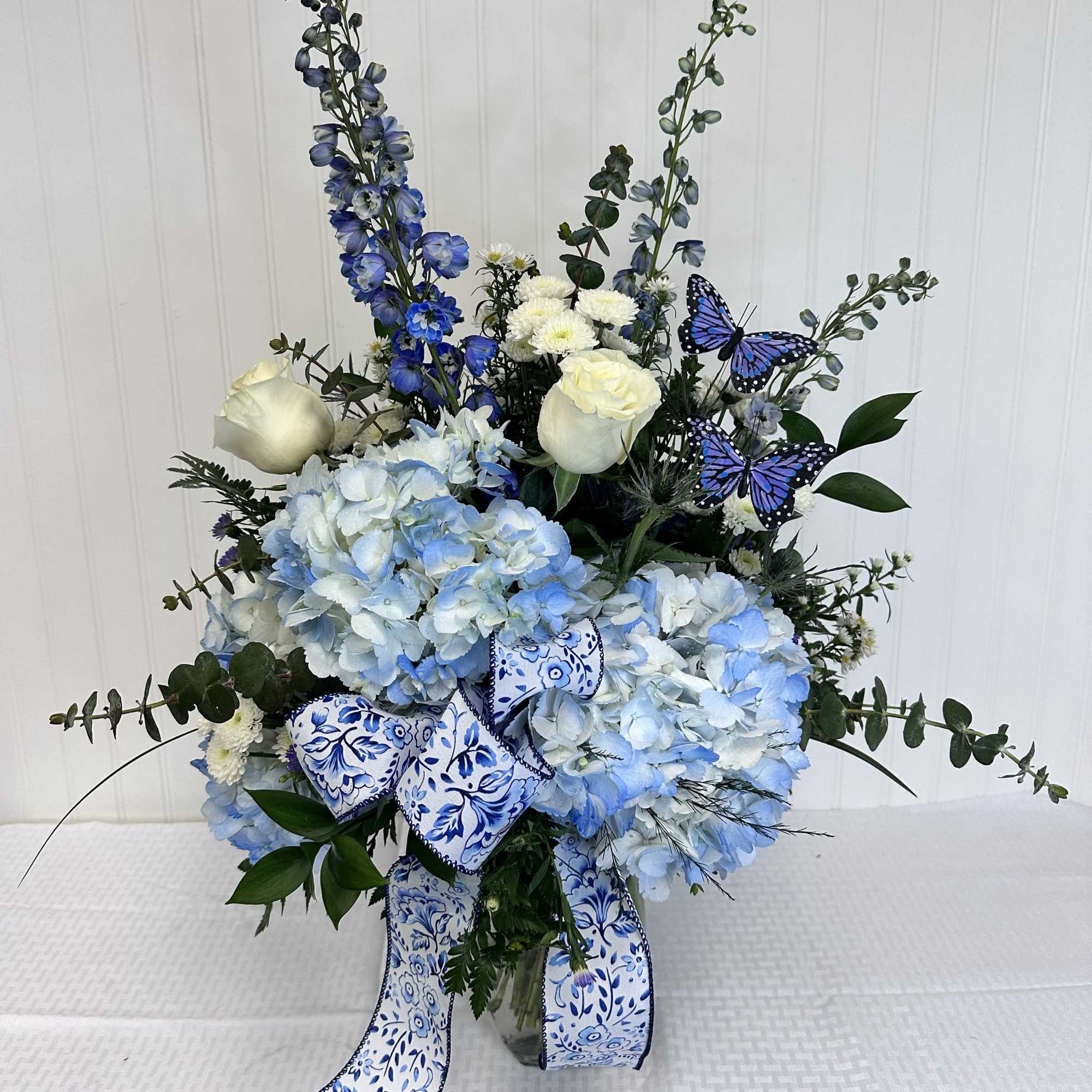 The Sonya is an elegant Mother's Day arrangement made solely of Blue
