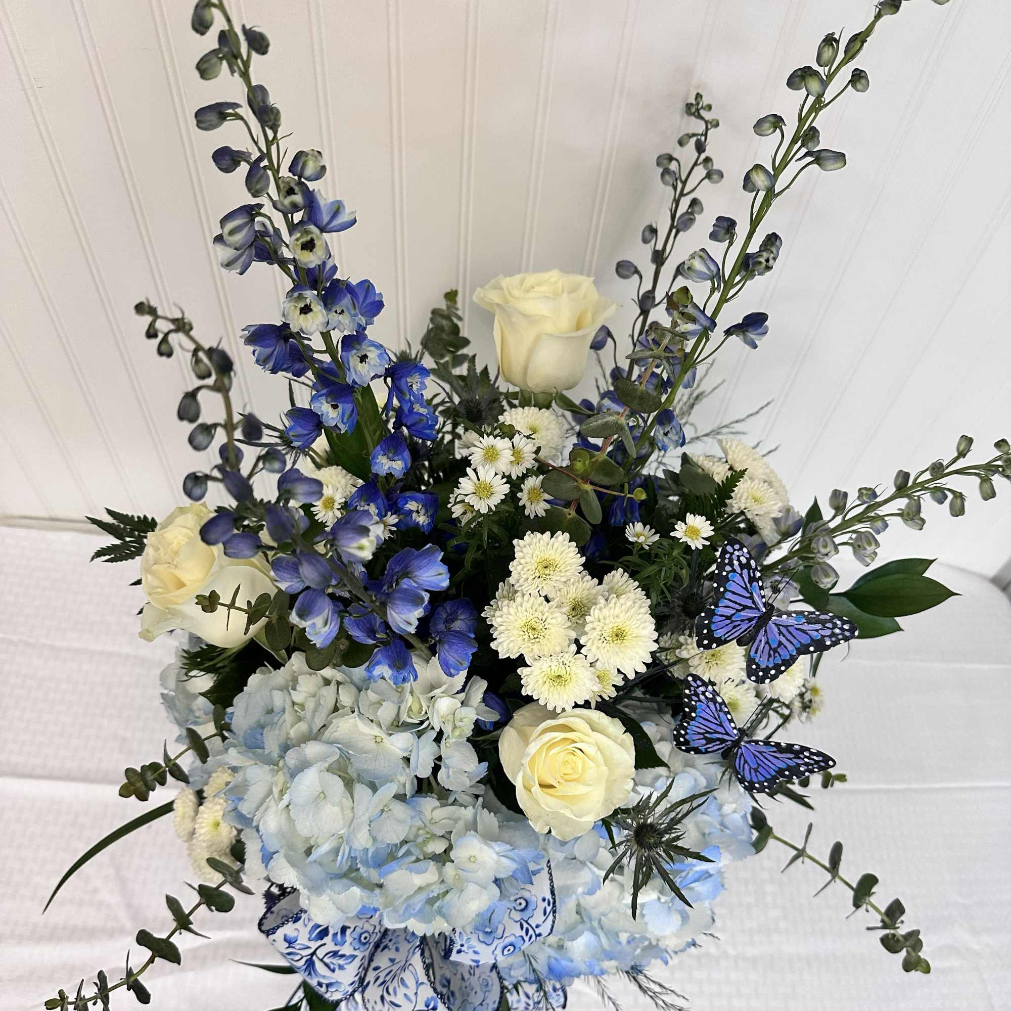 The Sonya is an elegant Mother's Day arrangement made solely of Blue