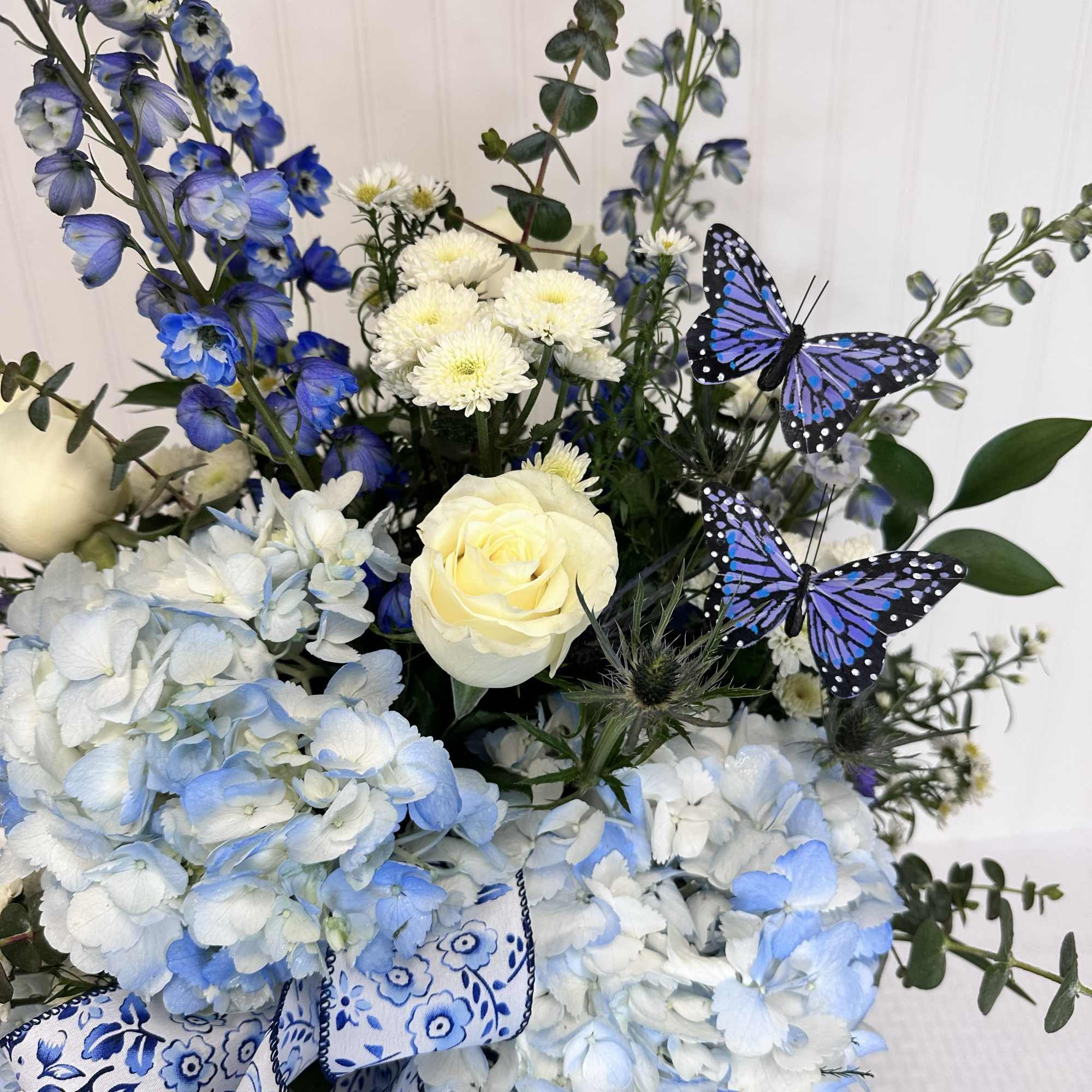 The Sonya is an elegant Mother's Day arrangement made solely of Blue