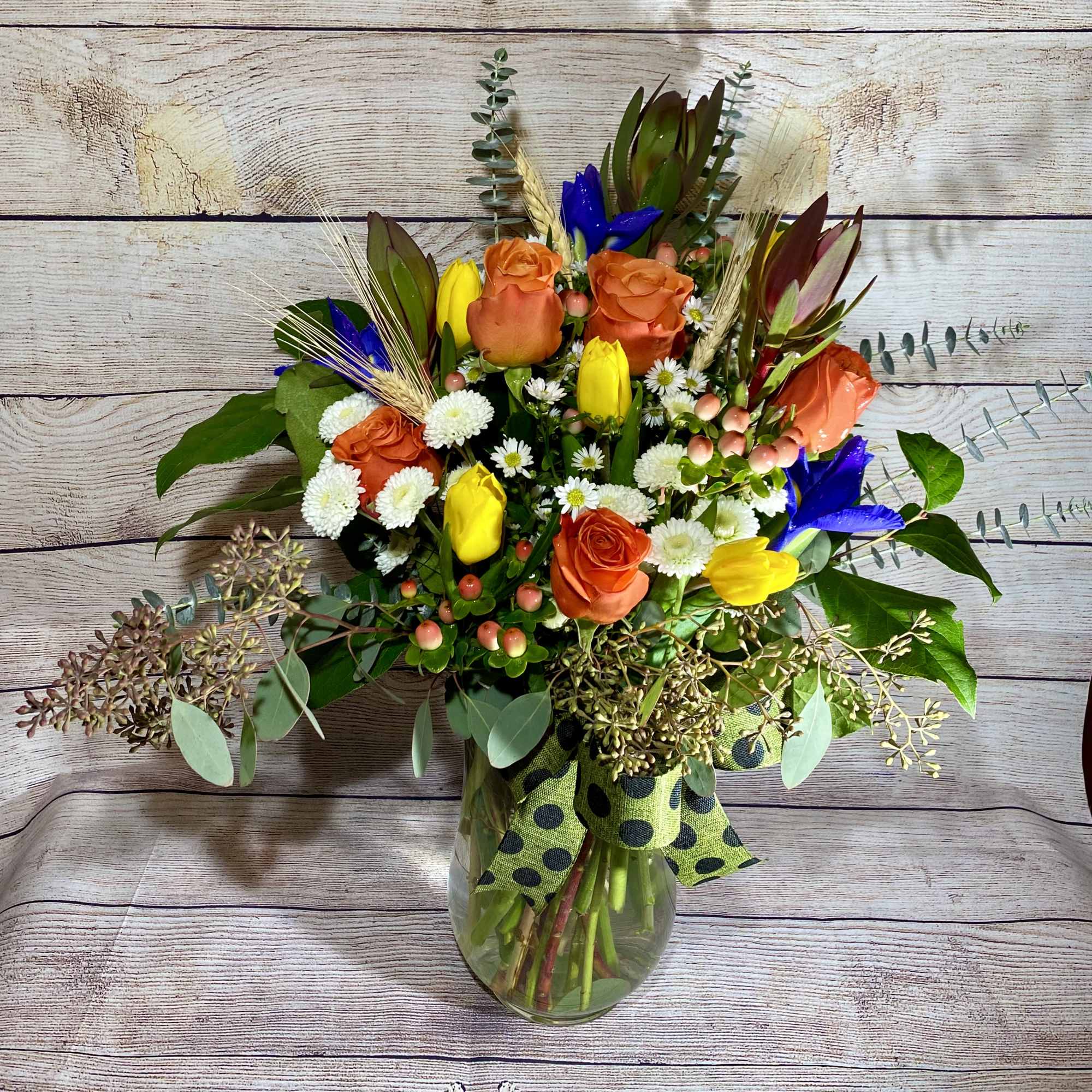 This beautiful arrangement is made of our freshest seasonal flowers. These flowers