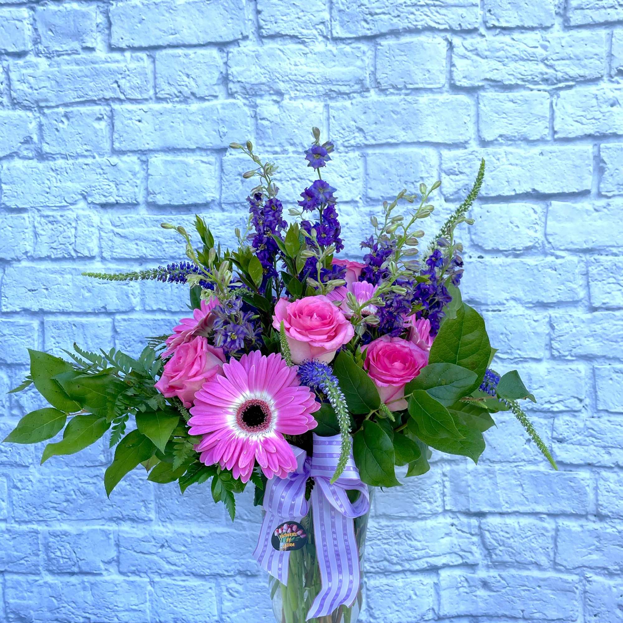 This beautiful arrangement is made of our freshest seasonal flowers. These flowers