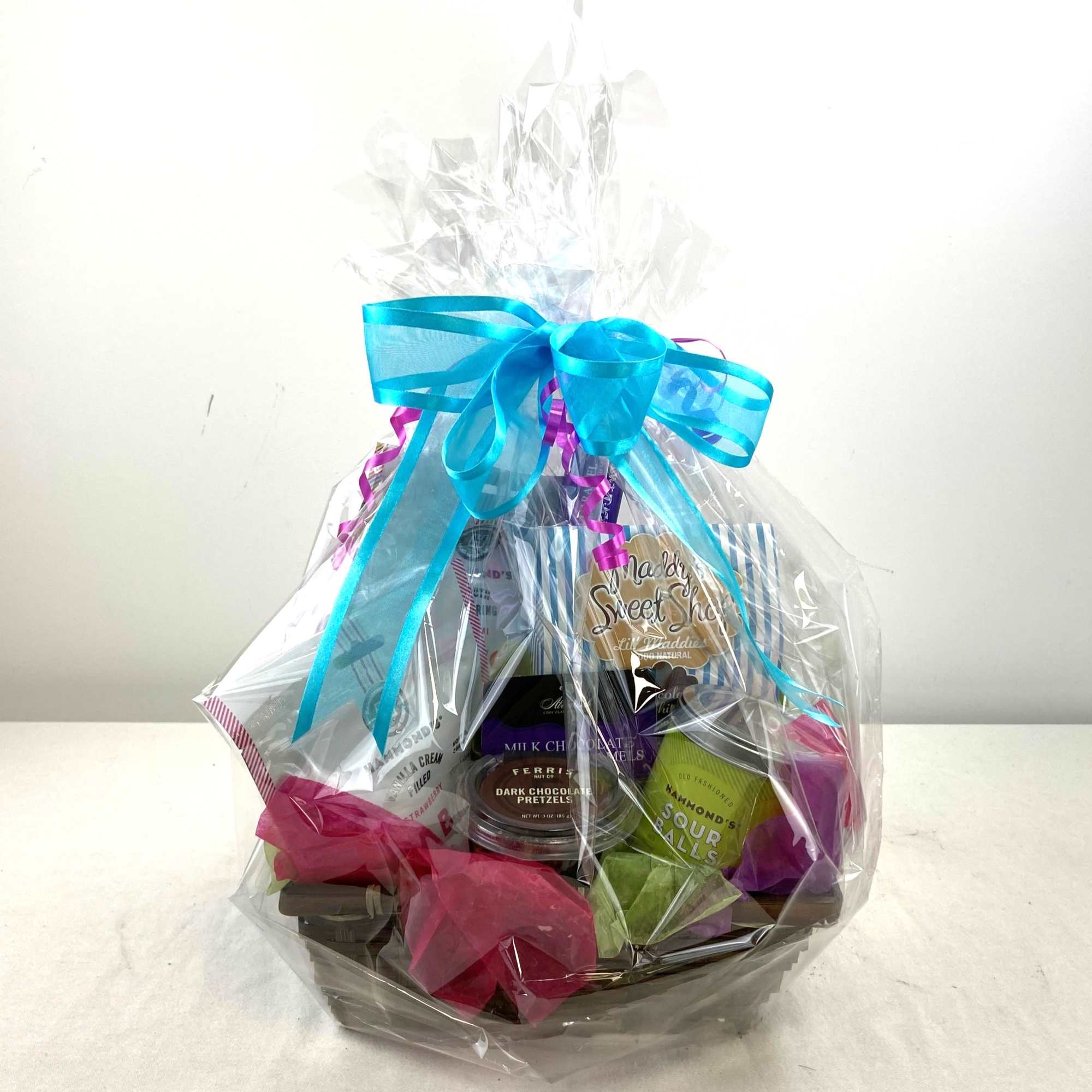 A playful assortment of treats arranged in a low woven basket, this