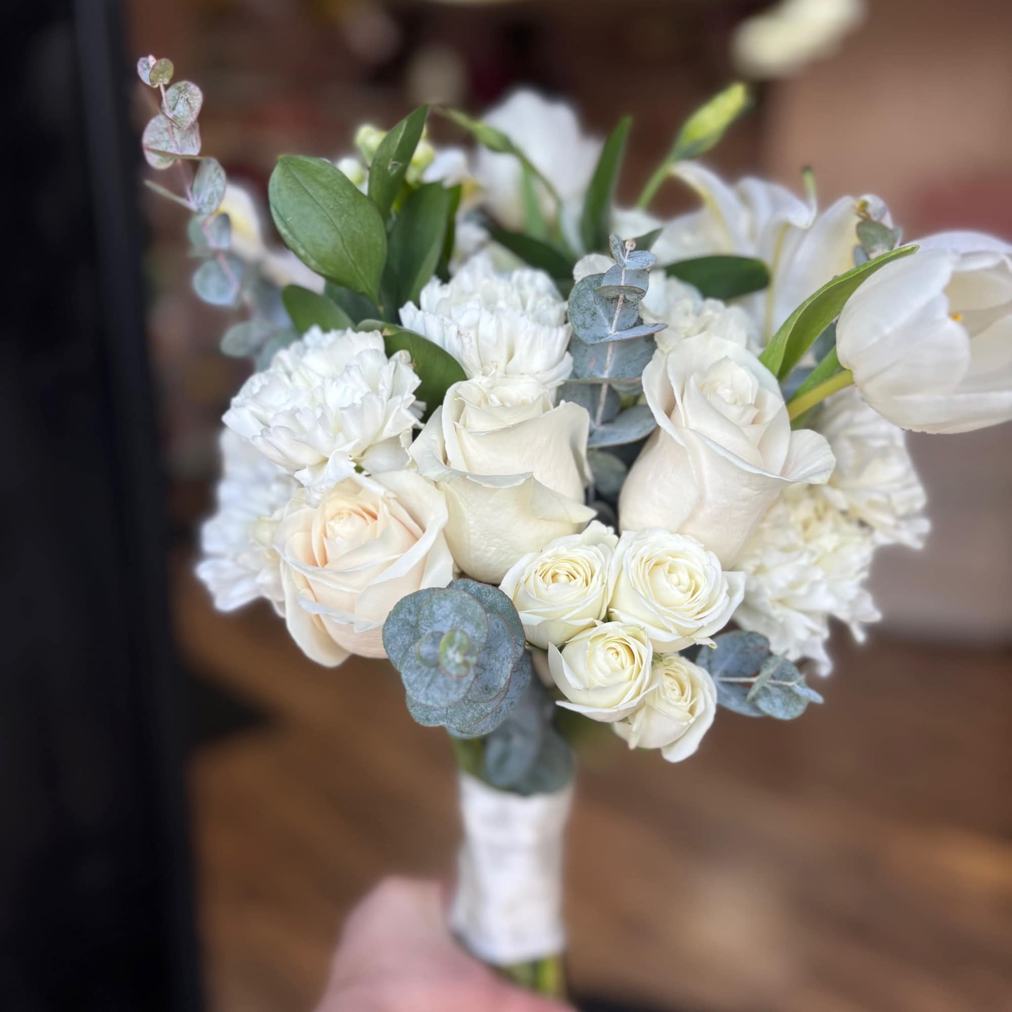 White rose and carnation bouquet with eucalyptus
