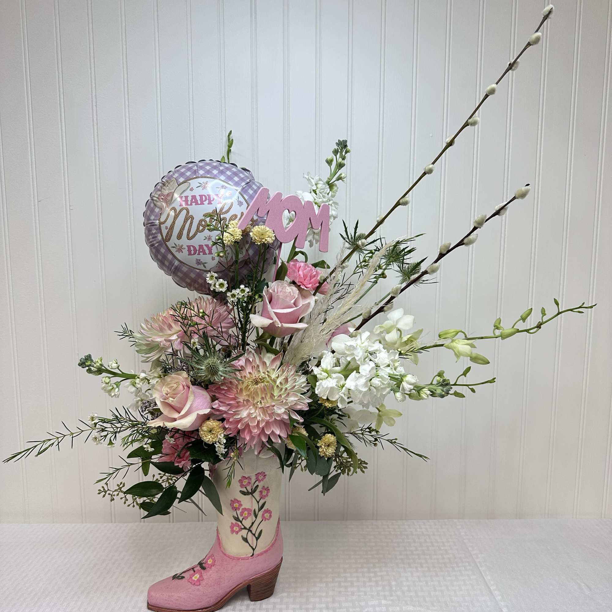 Our Amanda is a boot and blossom spectacular! This wildflower inspired arrangement