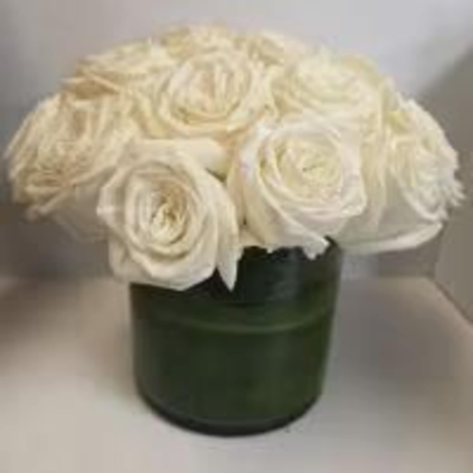 Roses!  Beautifully arranged in a classic vase make for an elegant