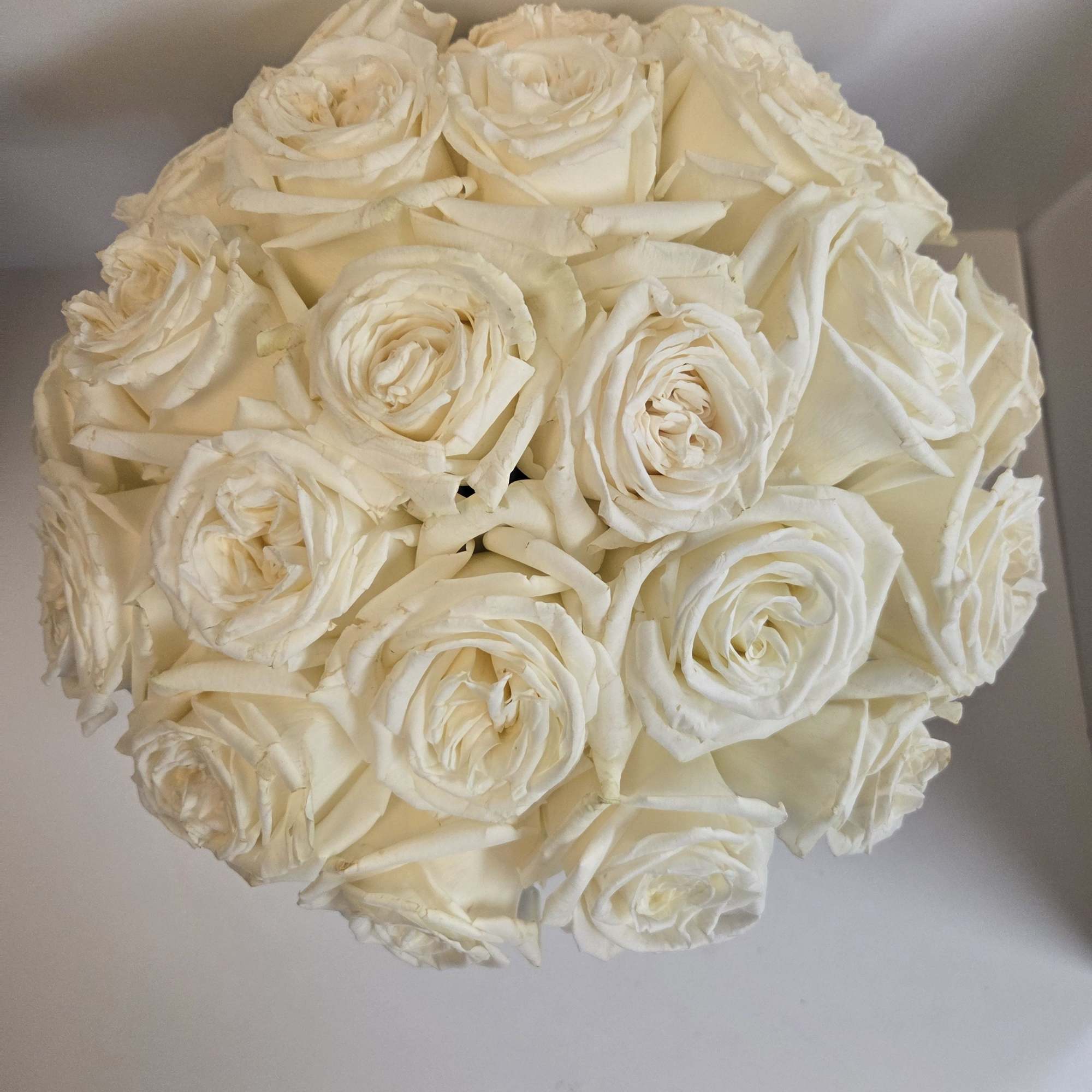 Roses!  Beautifully arranged in a classic vase make for an elegant