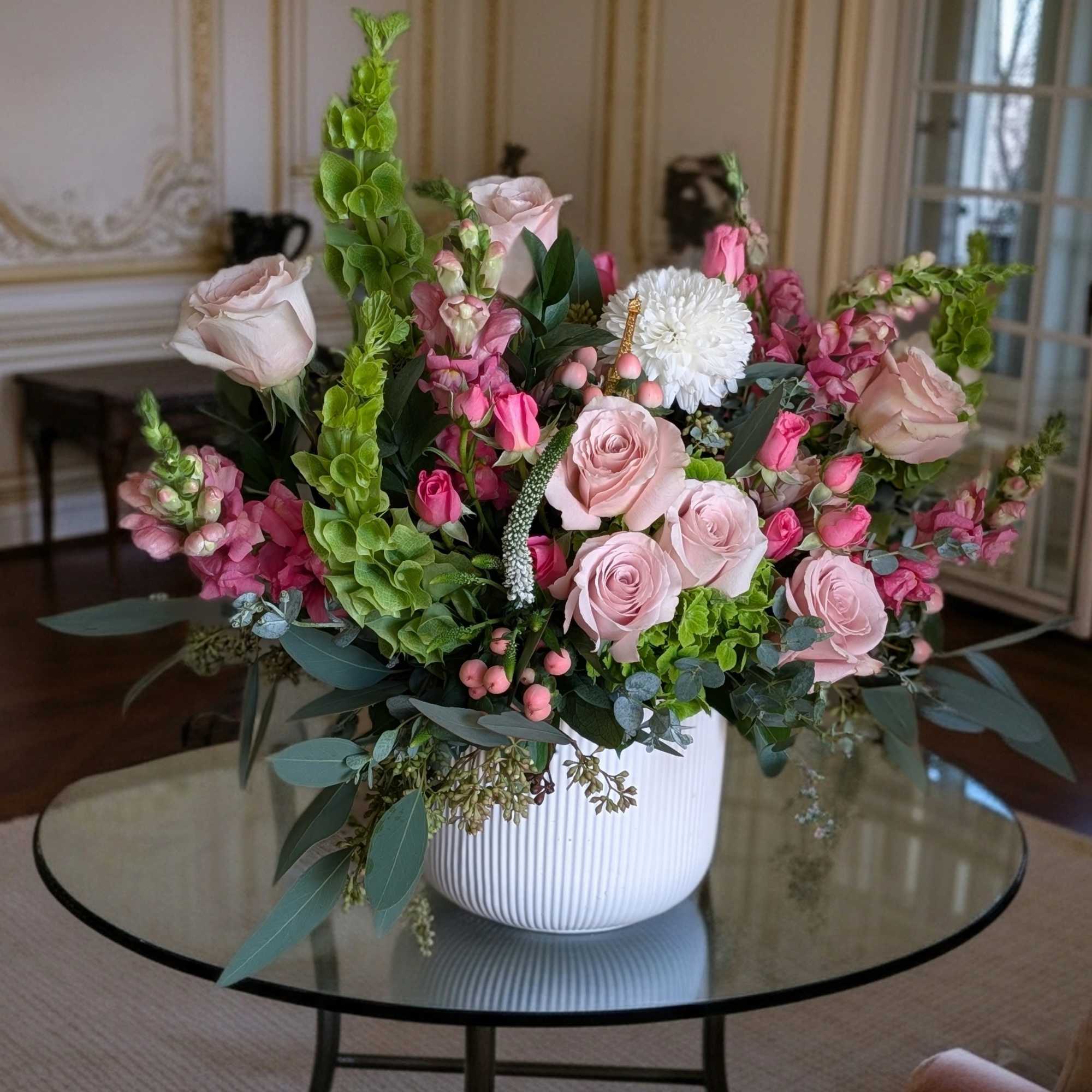 A garden style of soft blush, cream of seasonal flowers design in