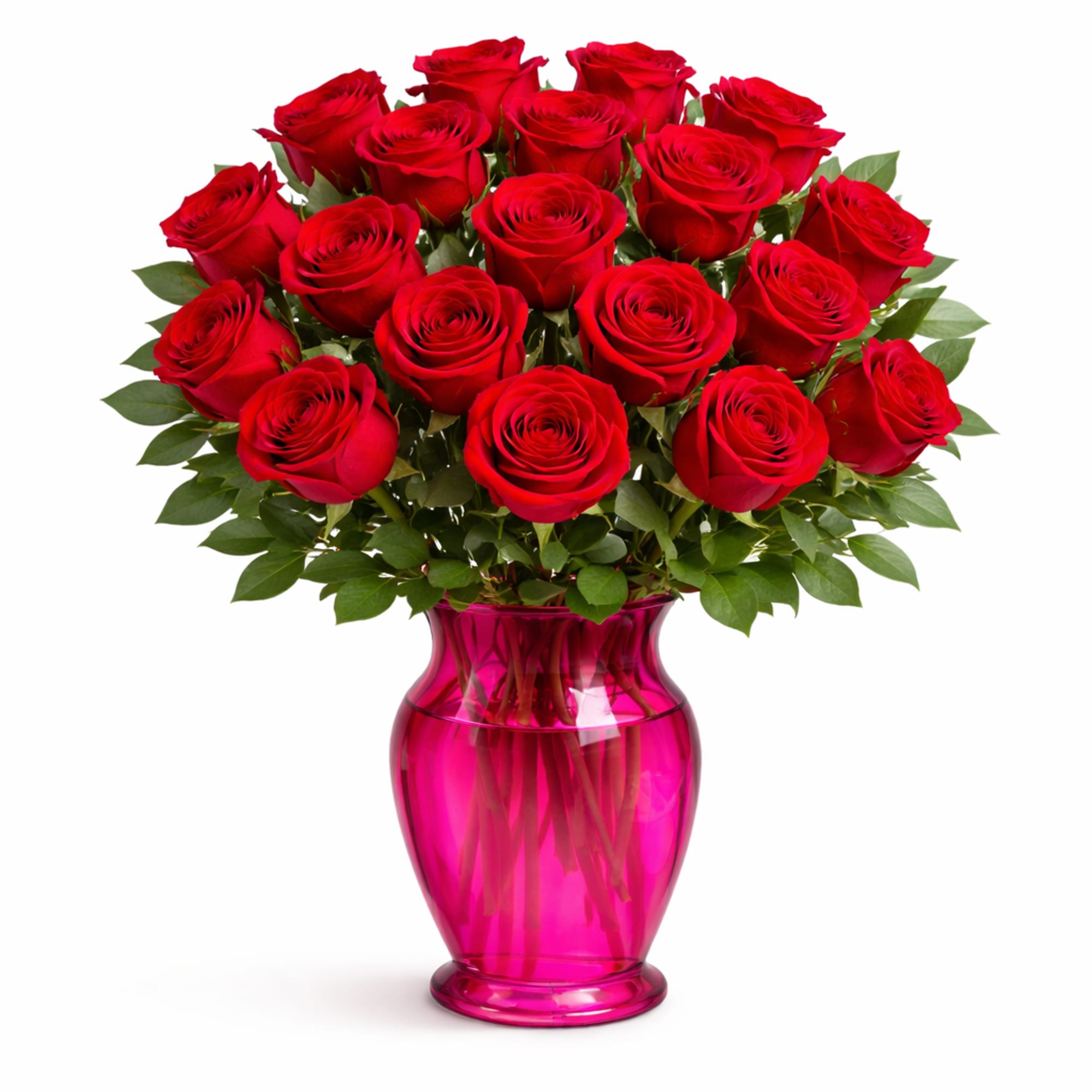 Red roses arranged in a pink glass vase