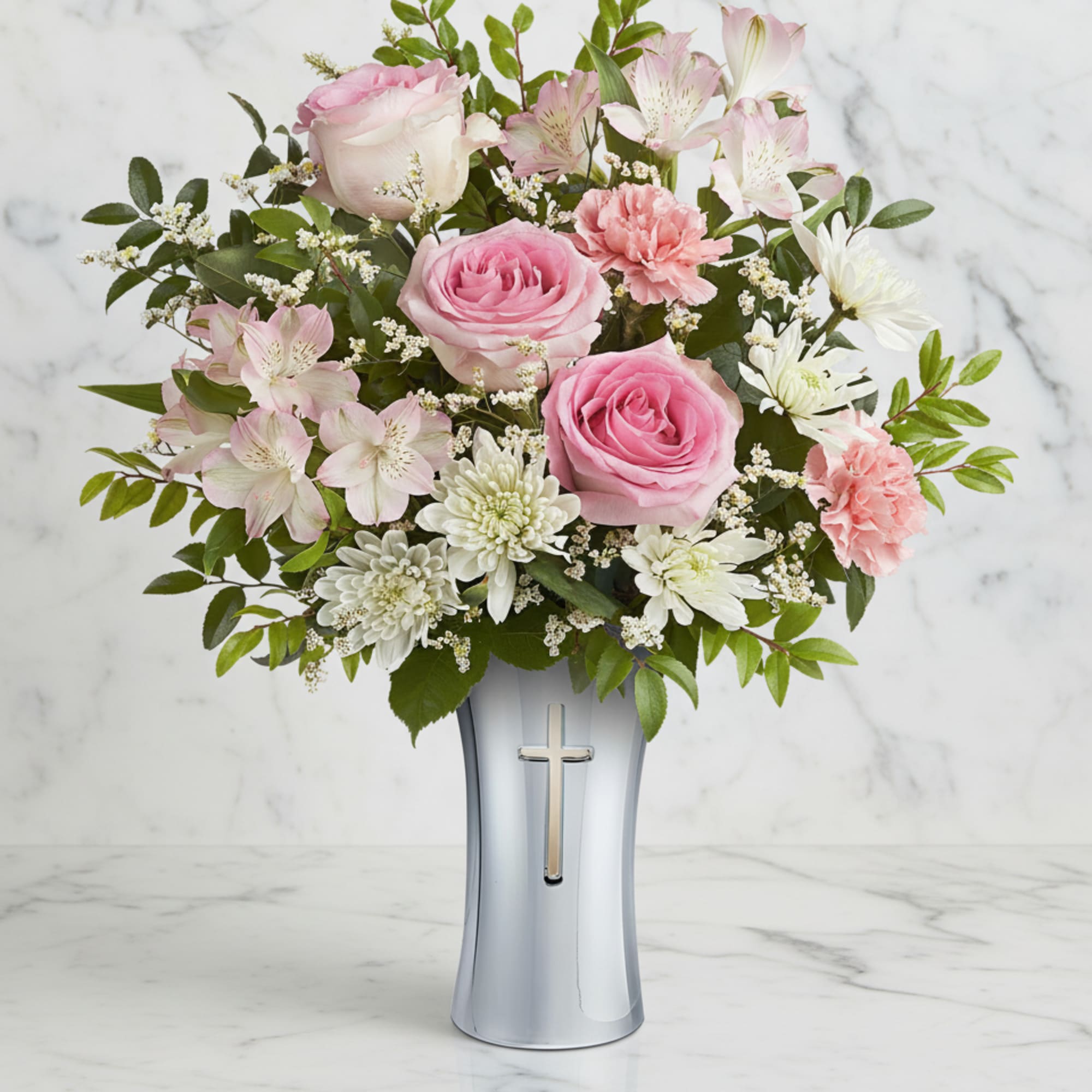Soft and serene, this graceful bouquet of delicate pink and white blooms