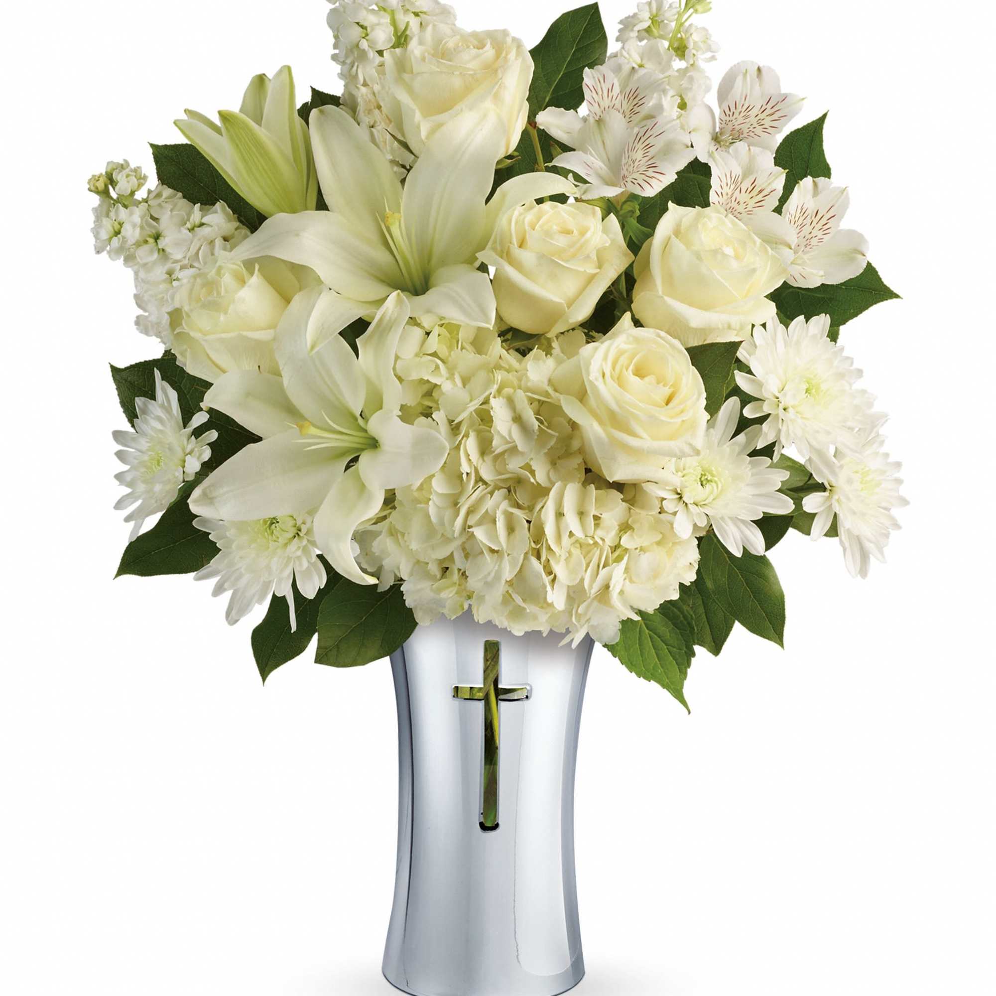 White floral arrangement in a silver vase with a cross