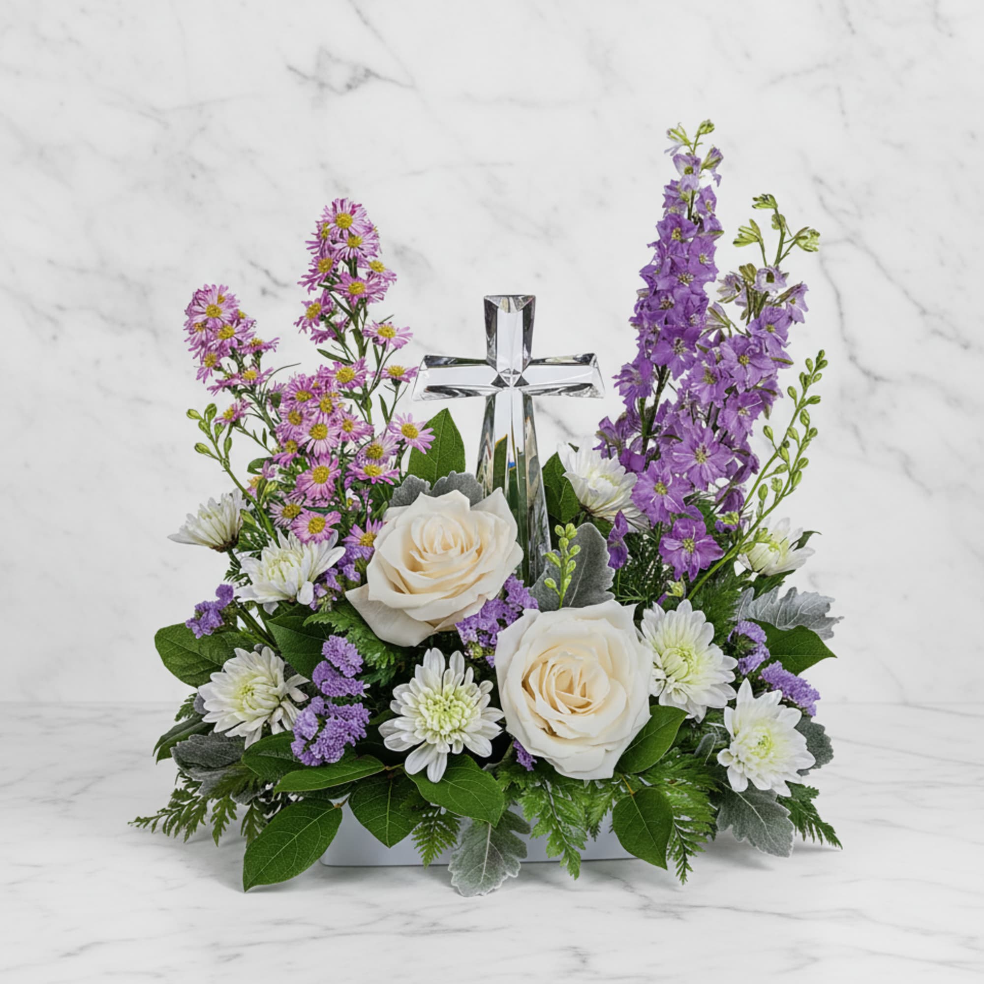 Soft and serene, this artistic array of cream and lavender blooms around