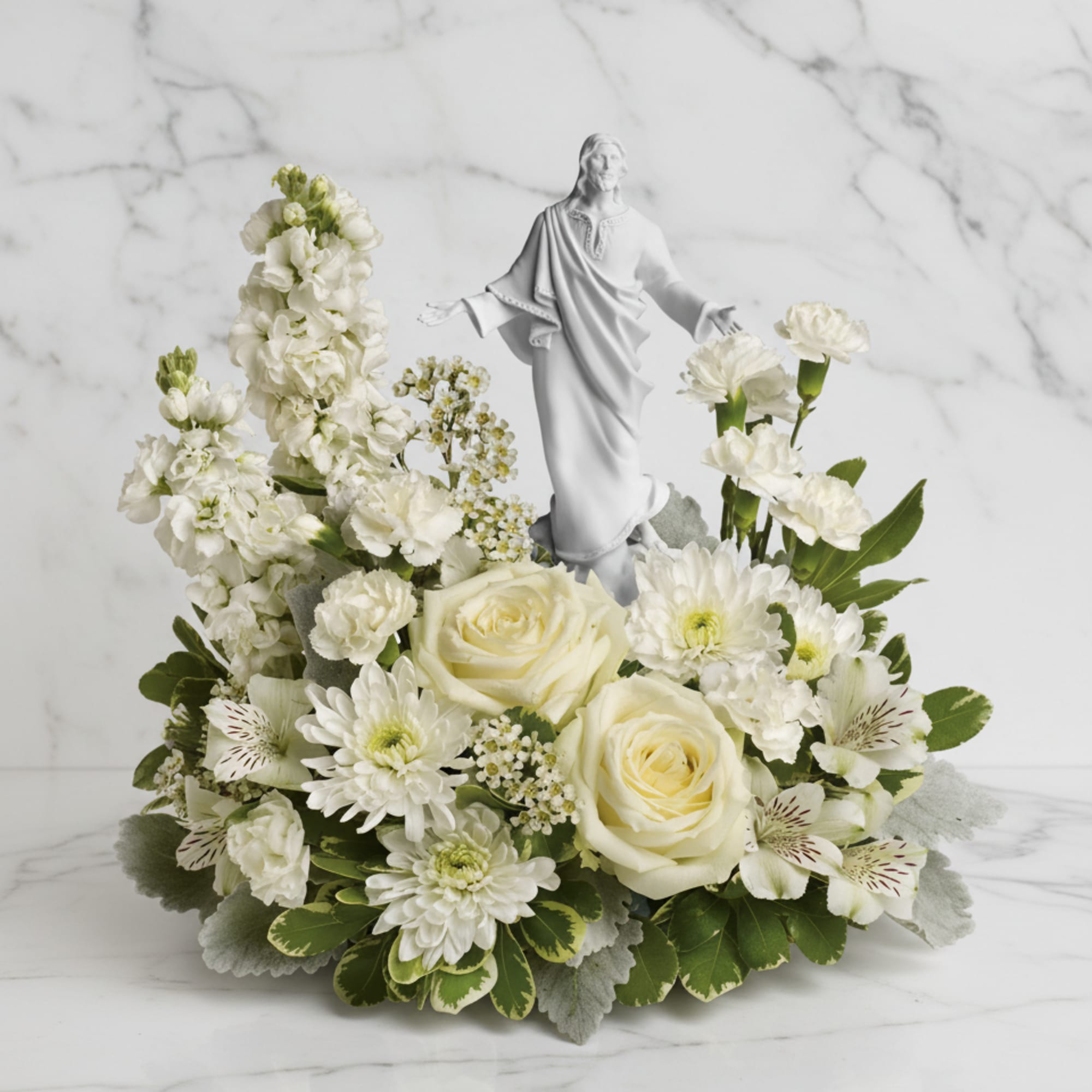 An elegant display of faith and grace, this beautiful arrangement will comfort