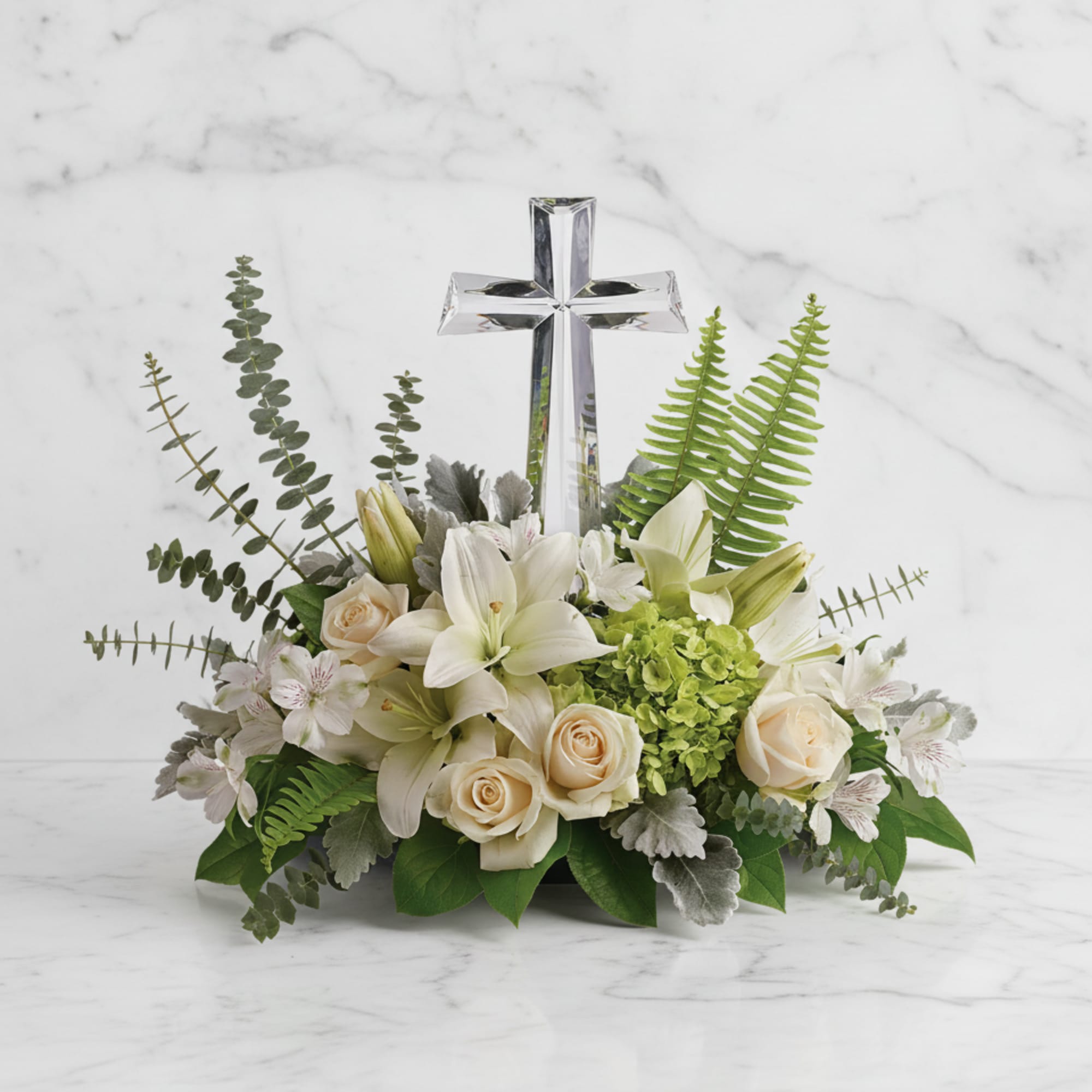 This peaceful bouquet of soft white flowers and green accents is a