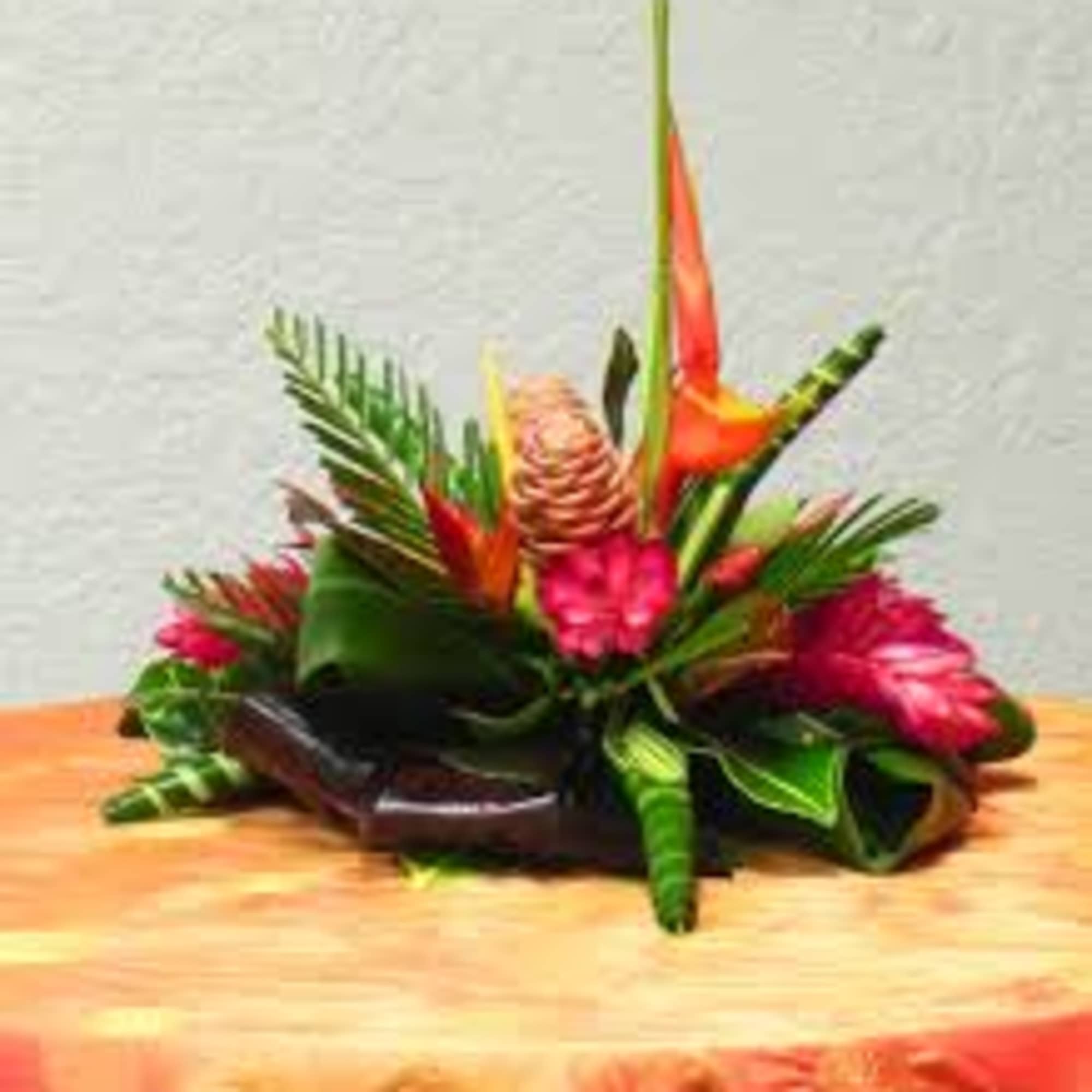 One  mixed tropical blooms and exotic foliage 