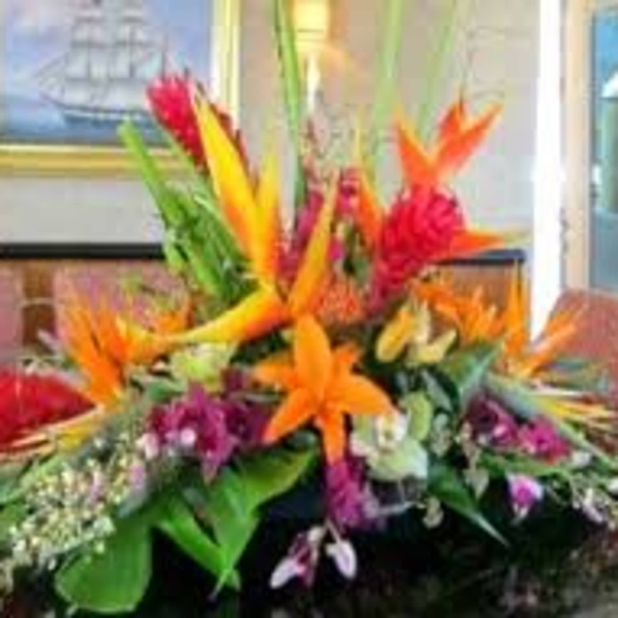 One  mixed tropical blooms and exotic foliage 