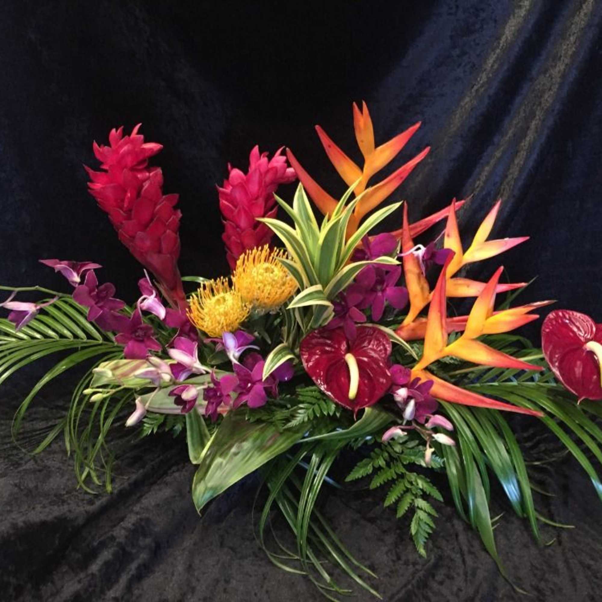 One  mixed tropical blooms and exotic foliage 