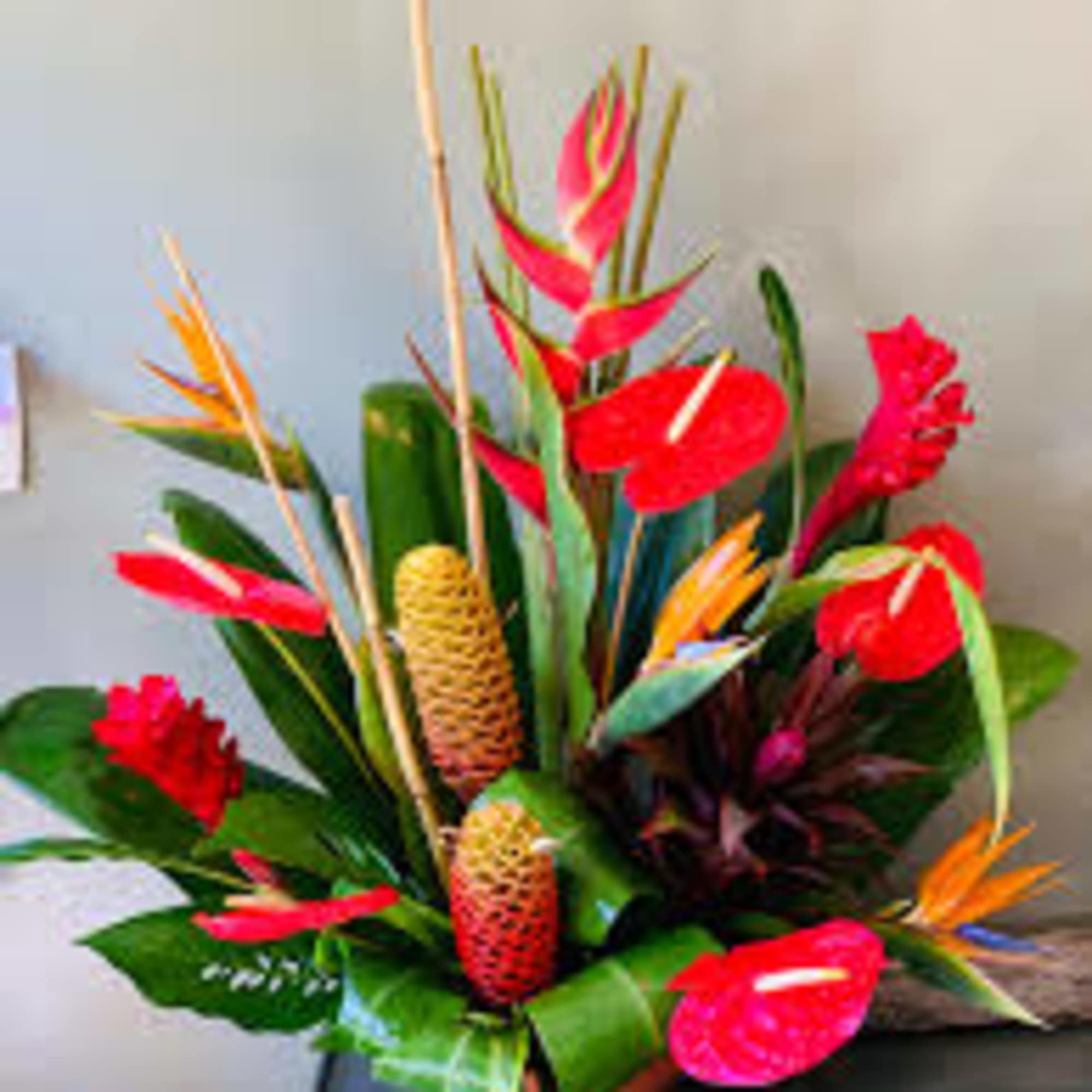 One  mixed tropical blooms and exotic foliage 