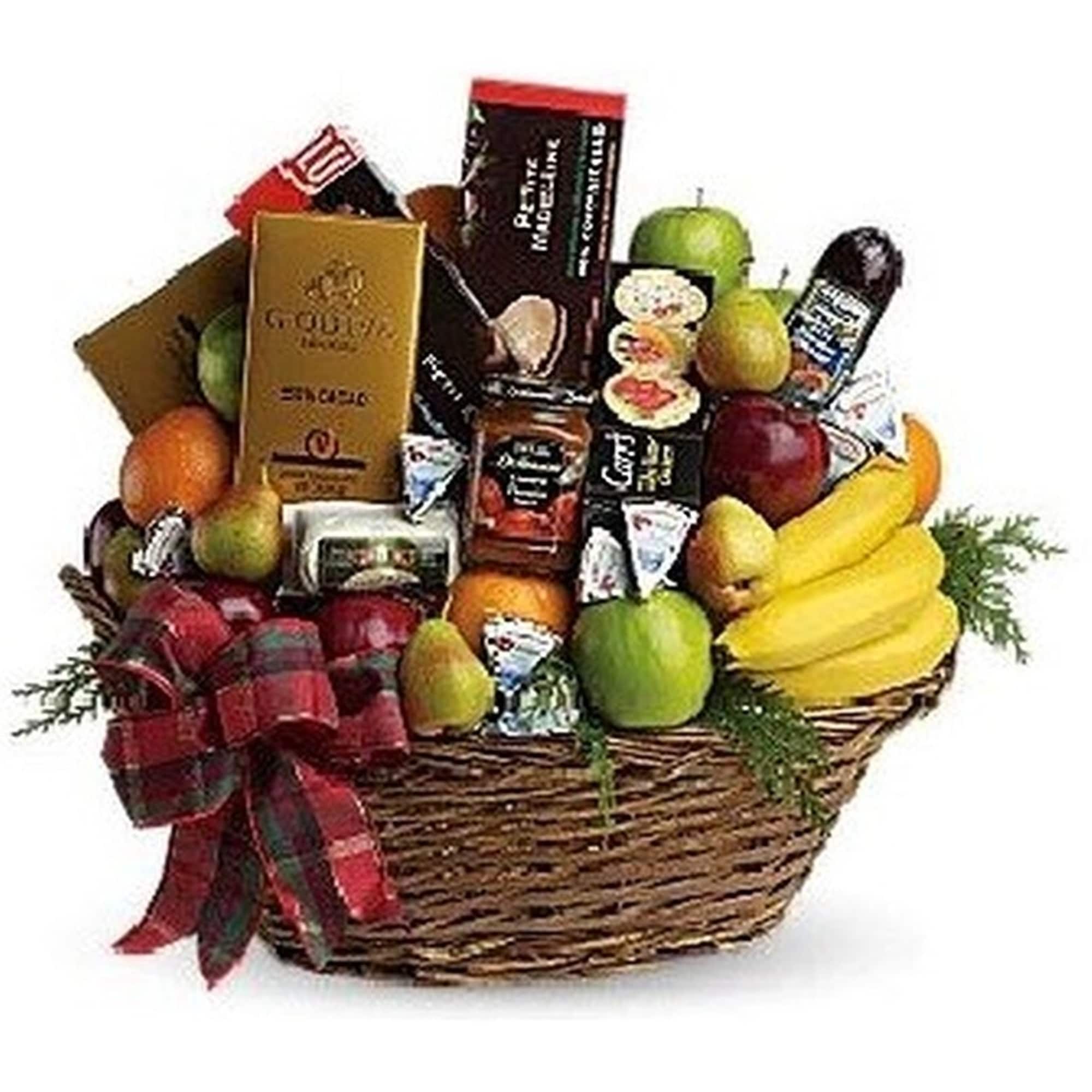 Large wicker gift basket filled with assorted fruits, gourmet snacks, and a plaid ribbon bow