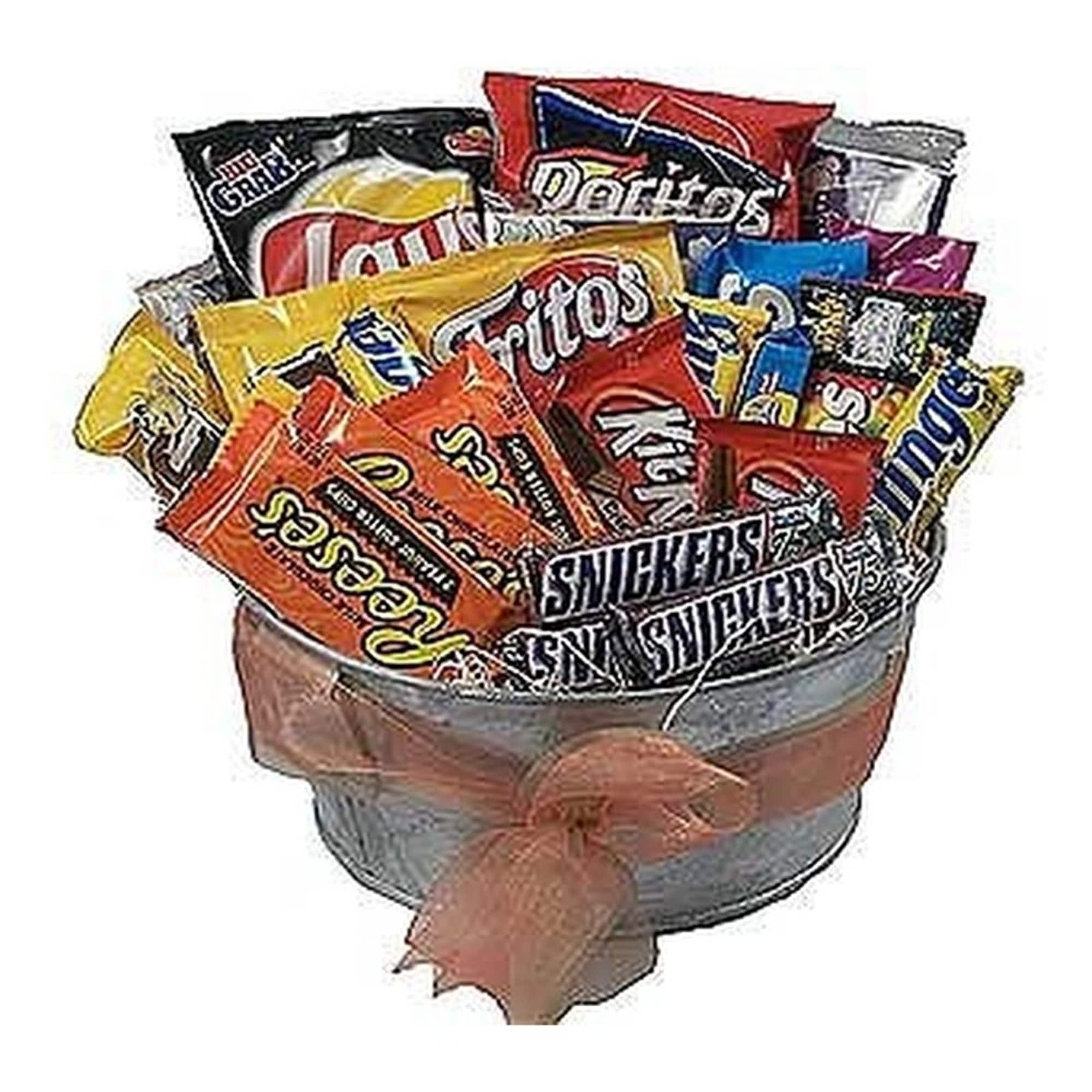 Metal bucket filled with assorted chips and candy bars, wrapped with a soft peach bow