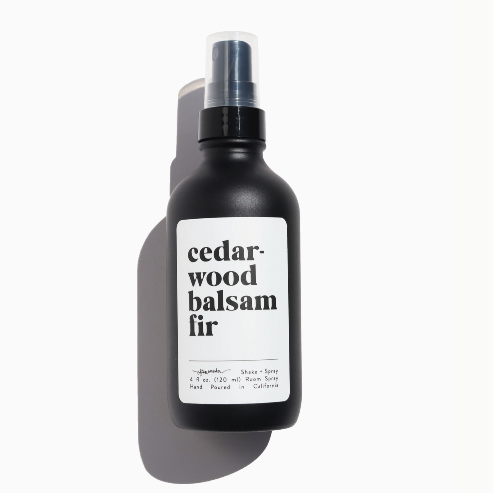 Black cedarwood balsam fir room spray bottle with white label