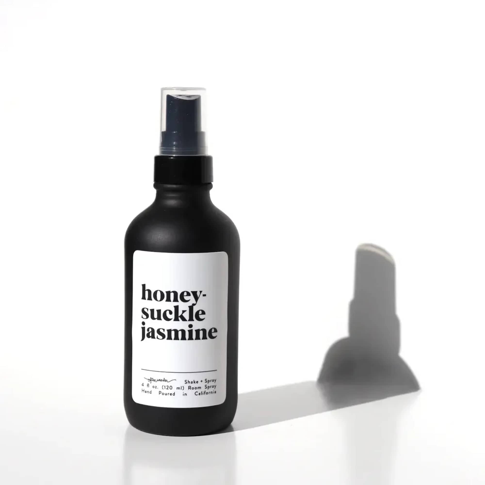 Black honeysuckle jasmine room spray bottle with white label on white background