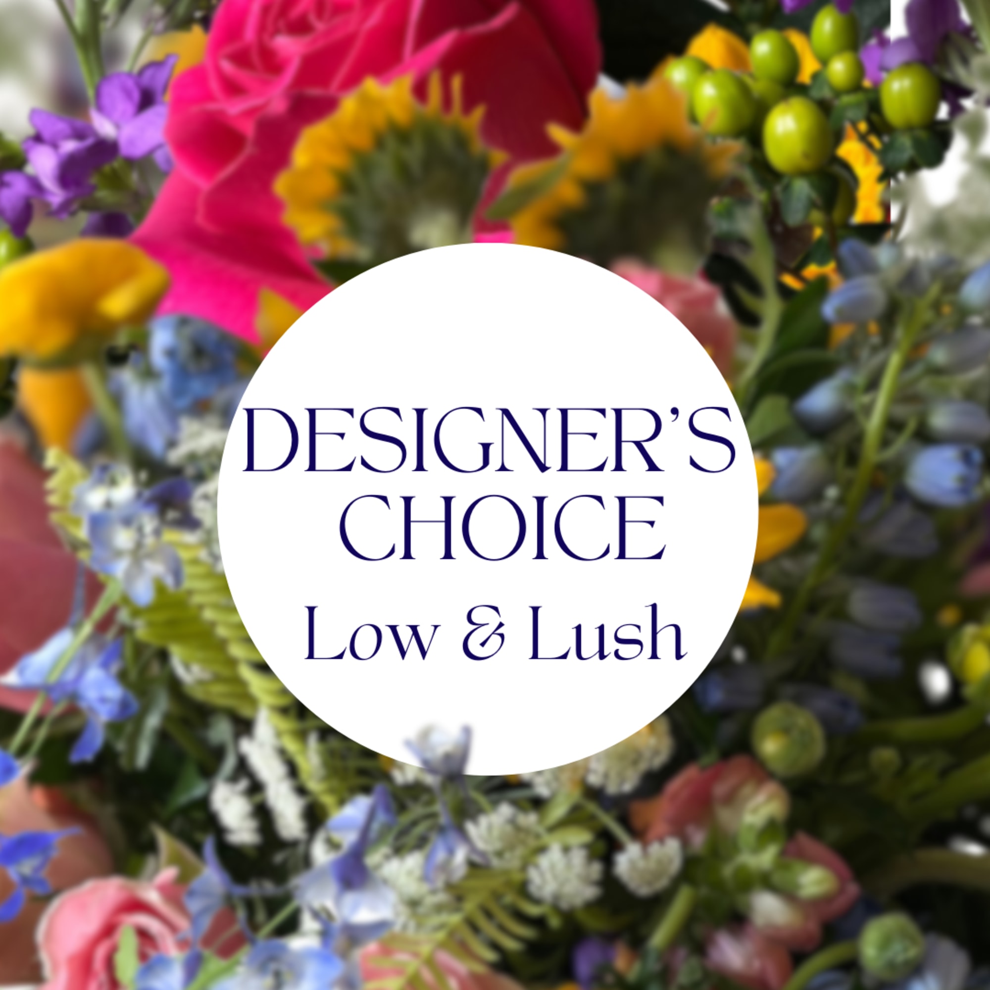 Trust our designers to create a beautiful, low and lush arrangement for