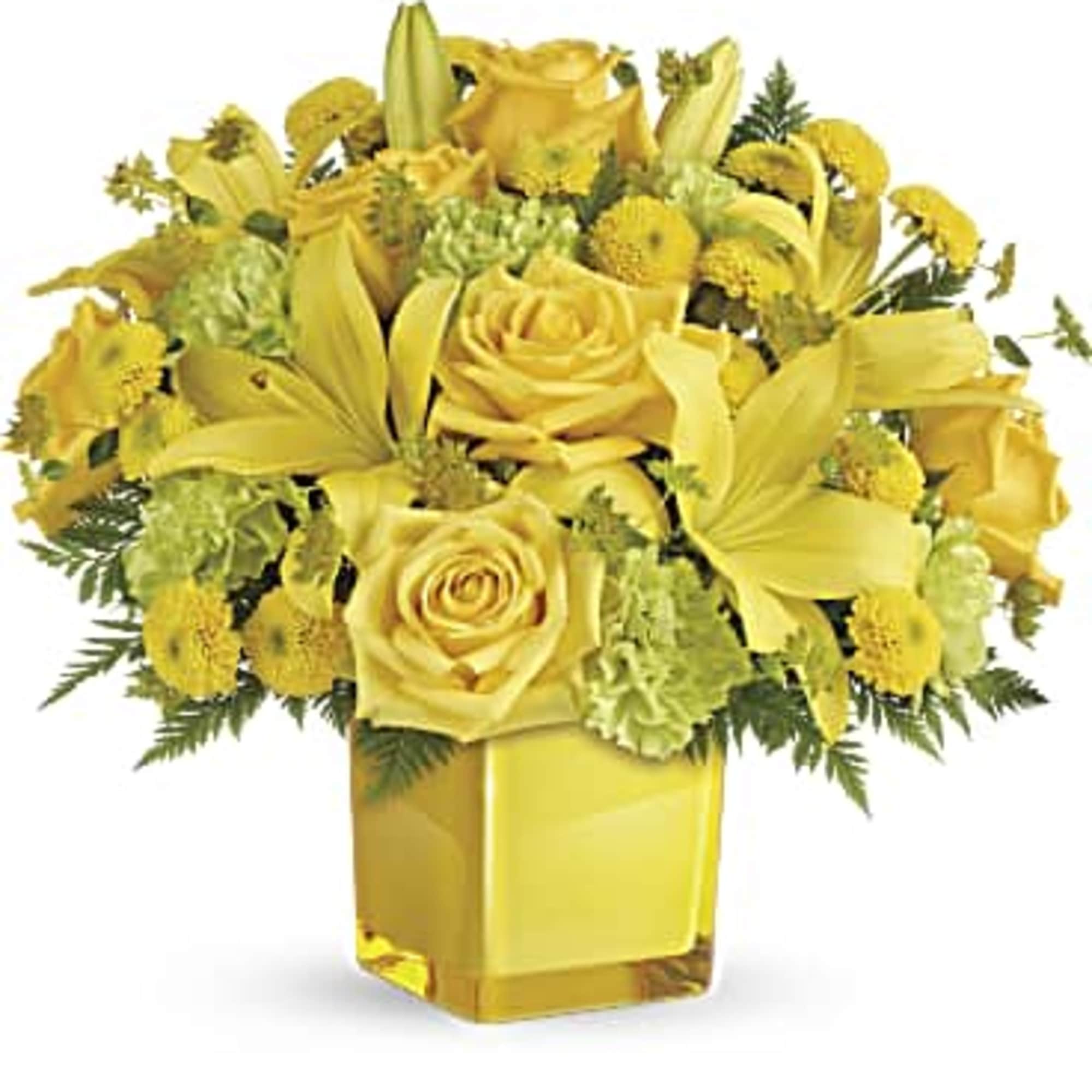 Yellow roses and lilies arranged in a square glass vase