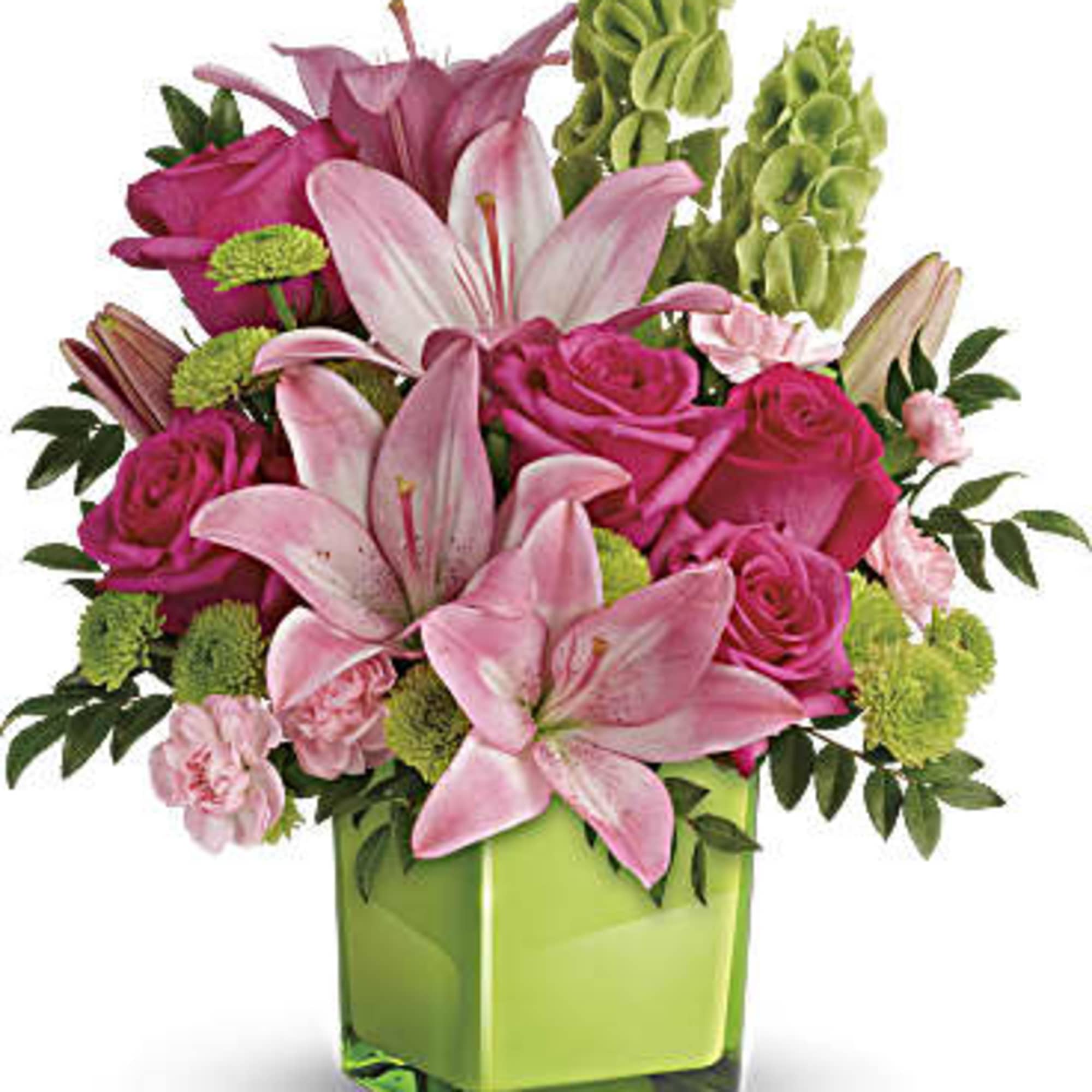 Pink lilies and roses in a green glass vase
