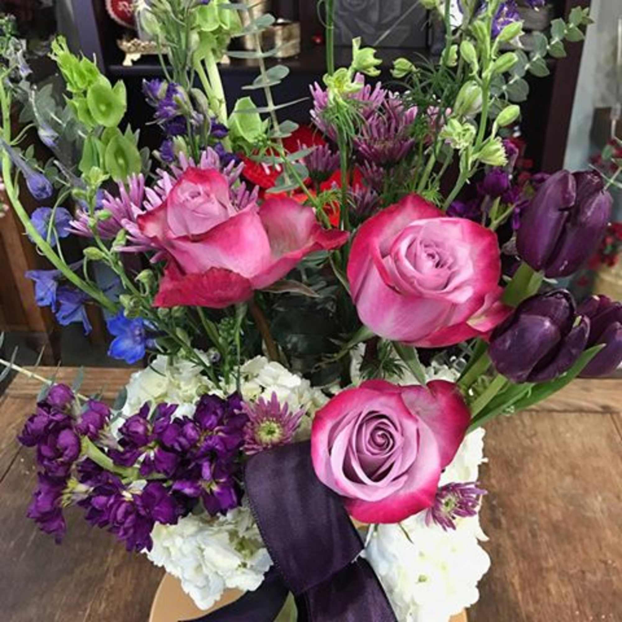 This bouquet displays the richness of the dark purple. 
This arrangement features: