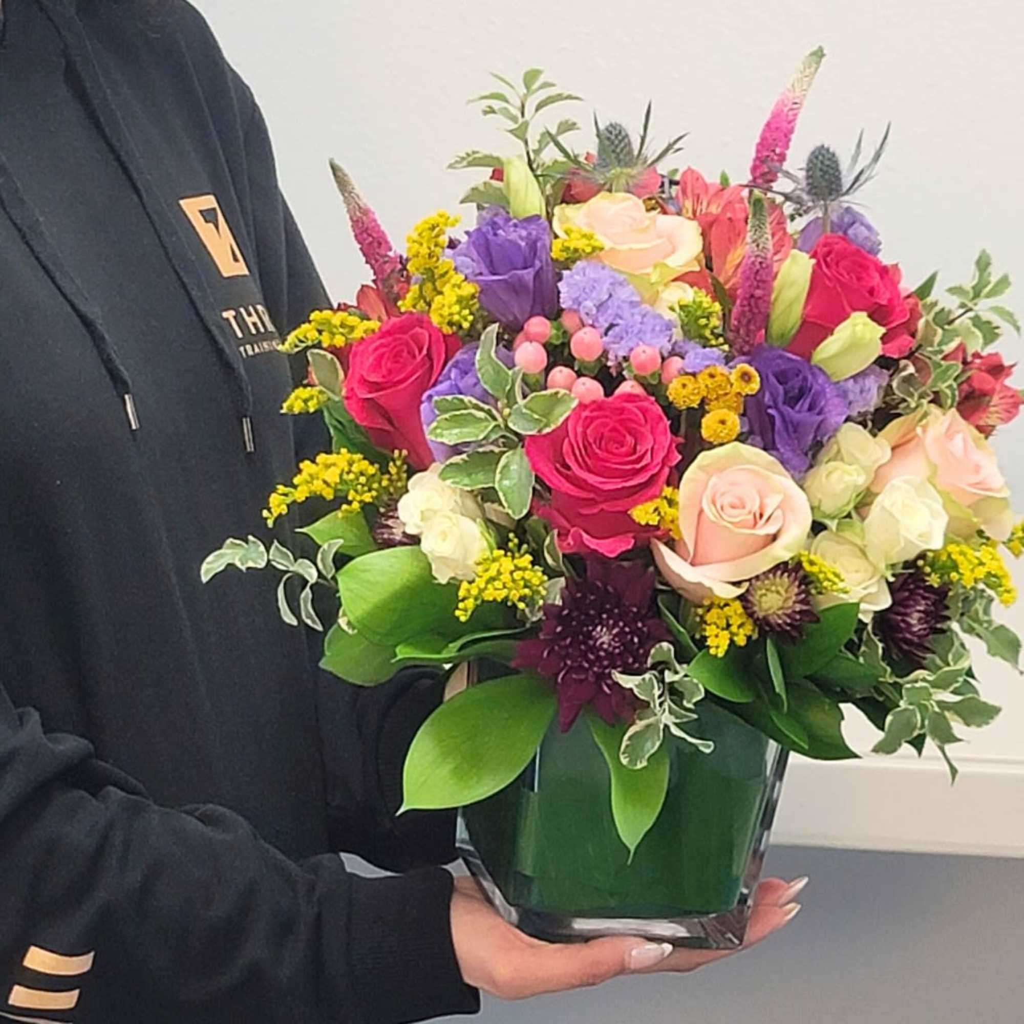 Brighten their day with our handcrafted Celebration Bouquet, bursting with fresh roses