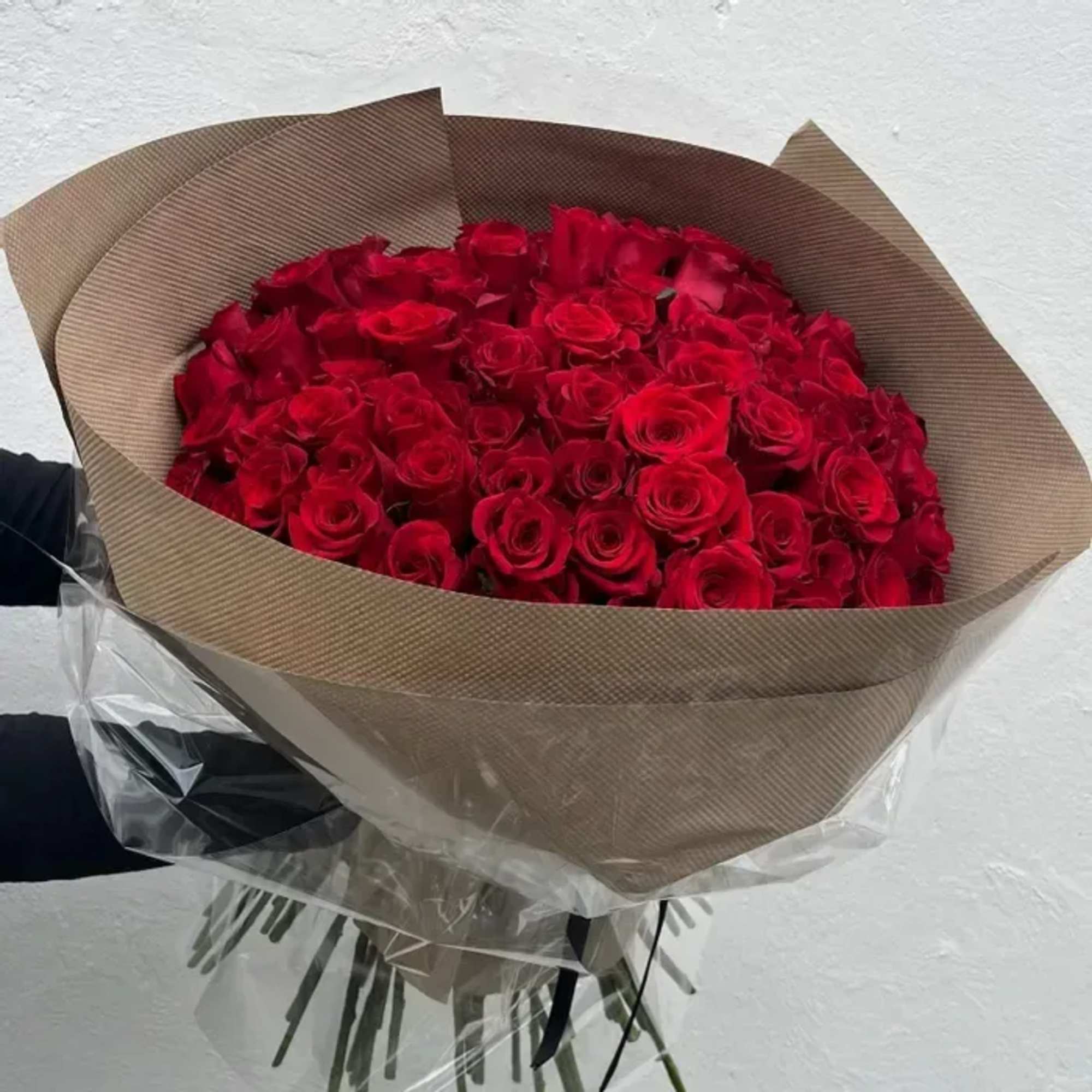 One hundred exquisite roses, hand-selected and wrapped with intention. A lavish expression