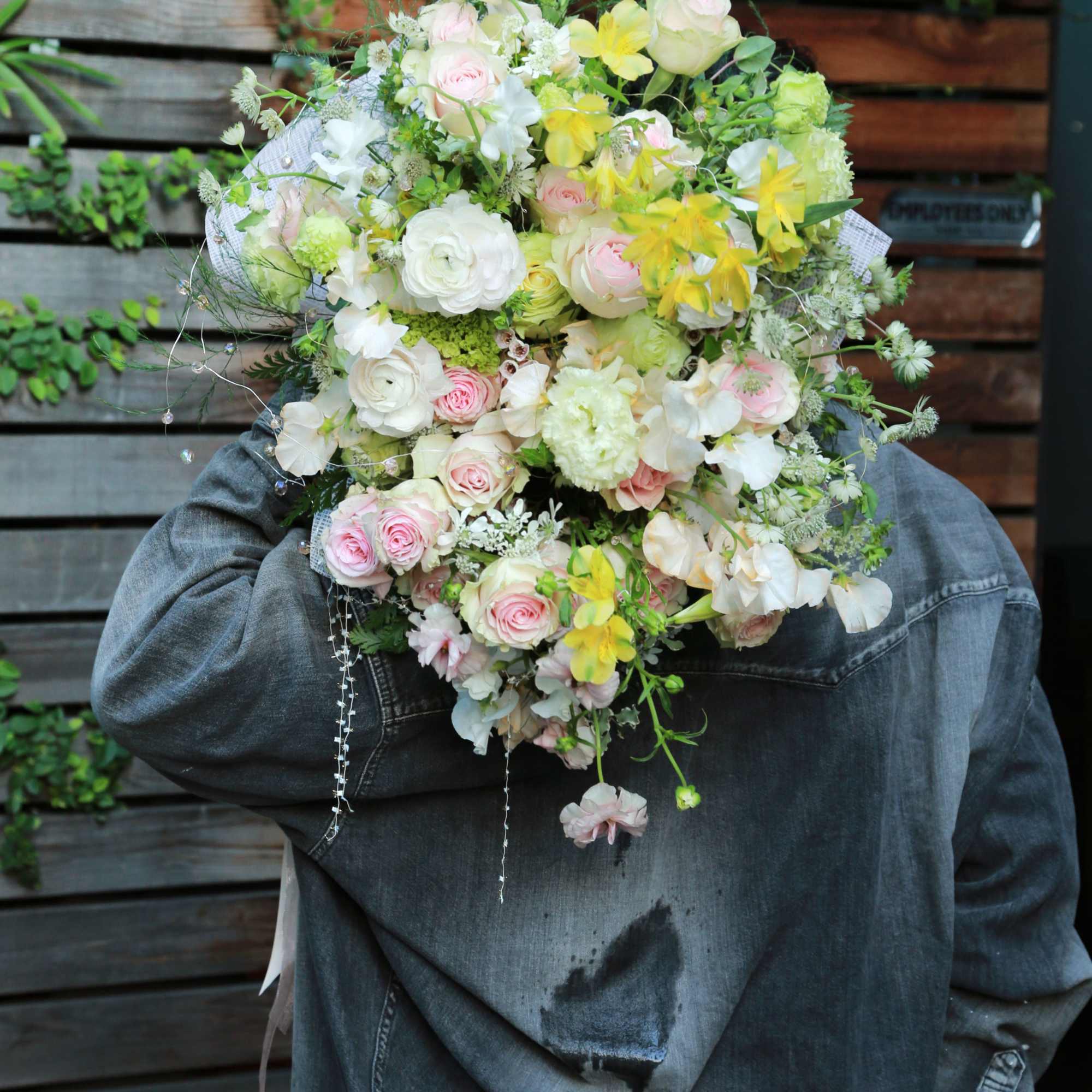 Pic shown as deluxe size. Features Blushes roses, ranunculus, sweet peas with