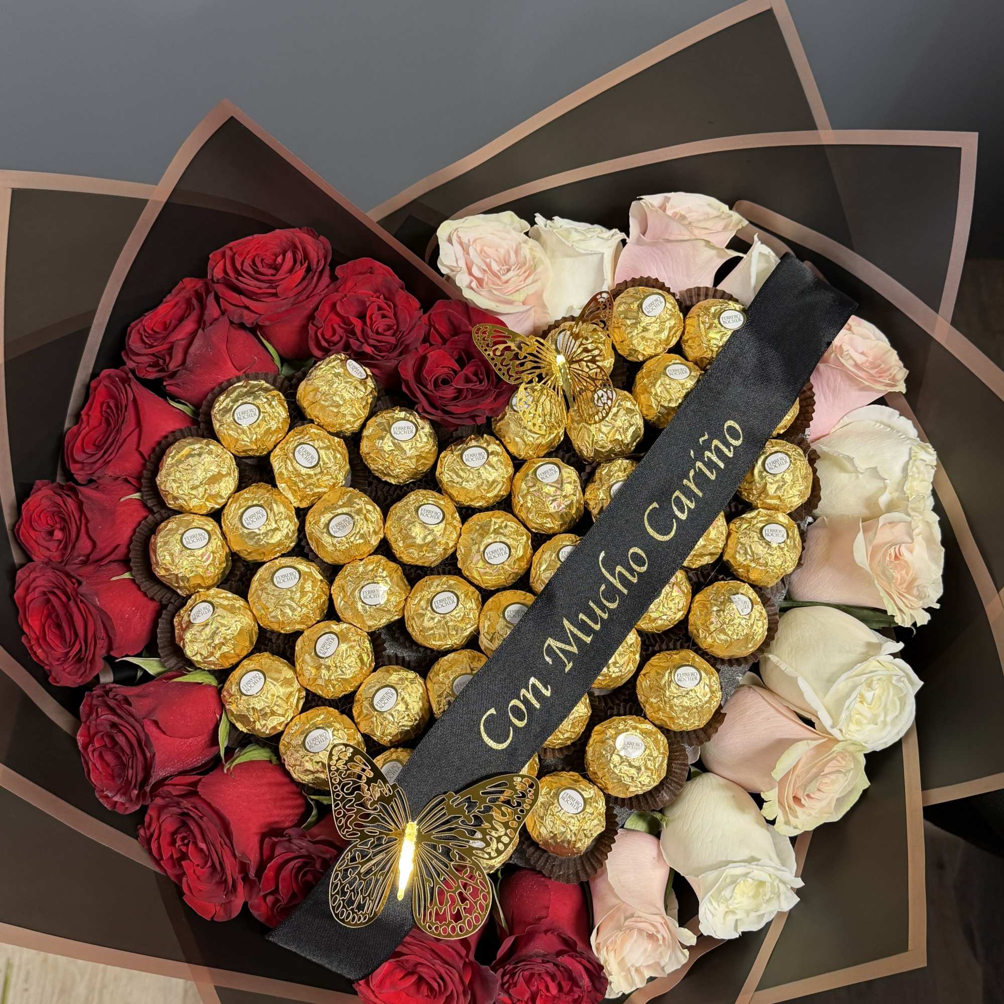 Be Mine Heart is a show-stopping heart-shaped wrapped bouquet designed to captivate