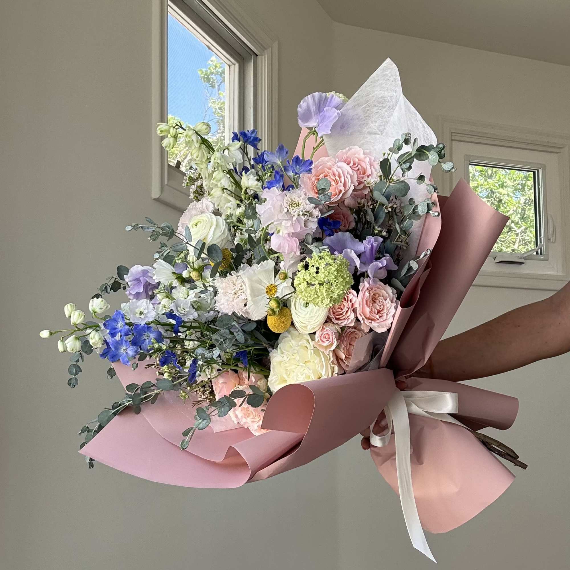 Each day brings a new surprise&mdash;our wrapped bouquets are created fresh with