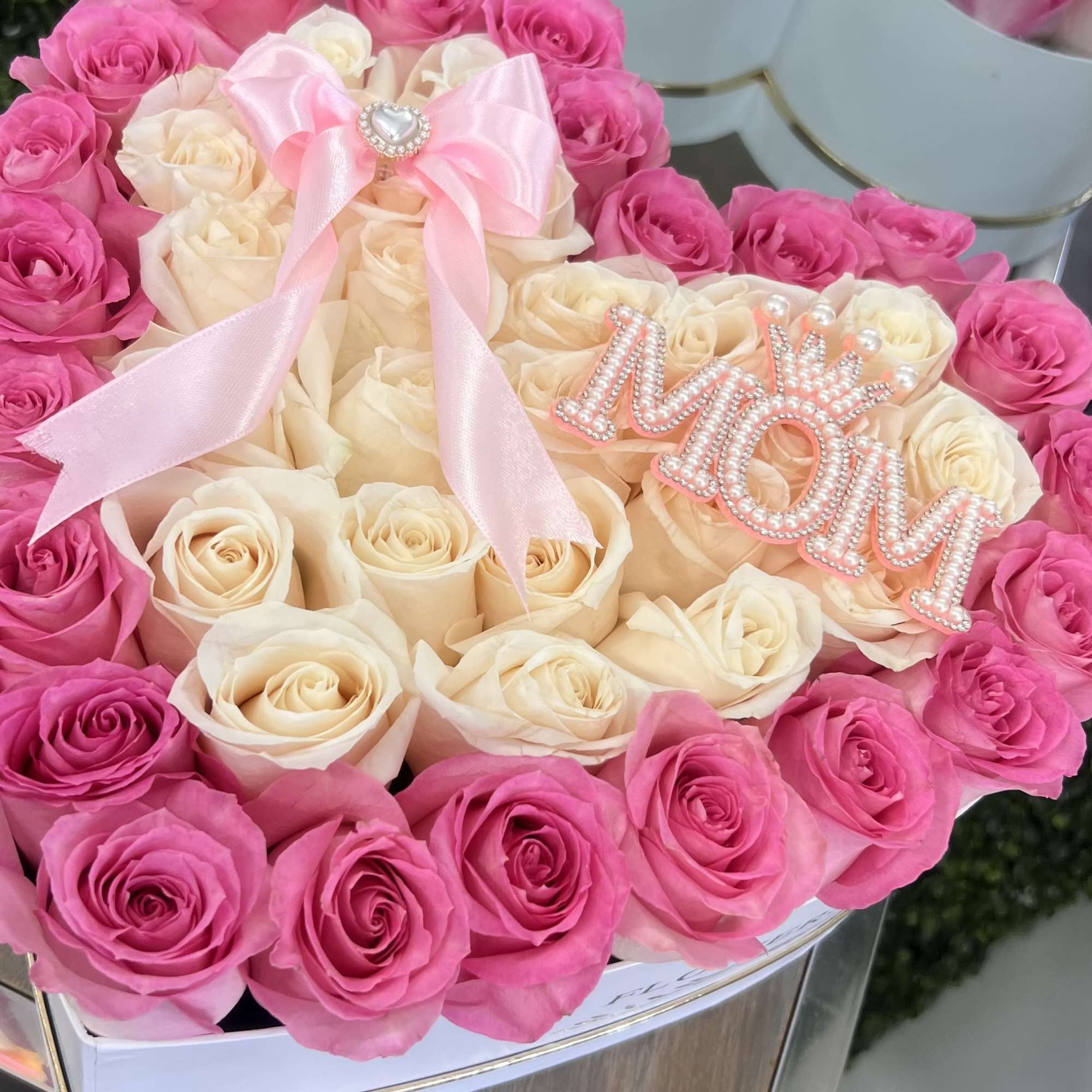 
A luxurious heart-shaped box featuring Pink And White roses, crafted to celebrate