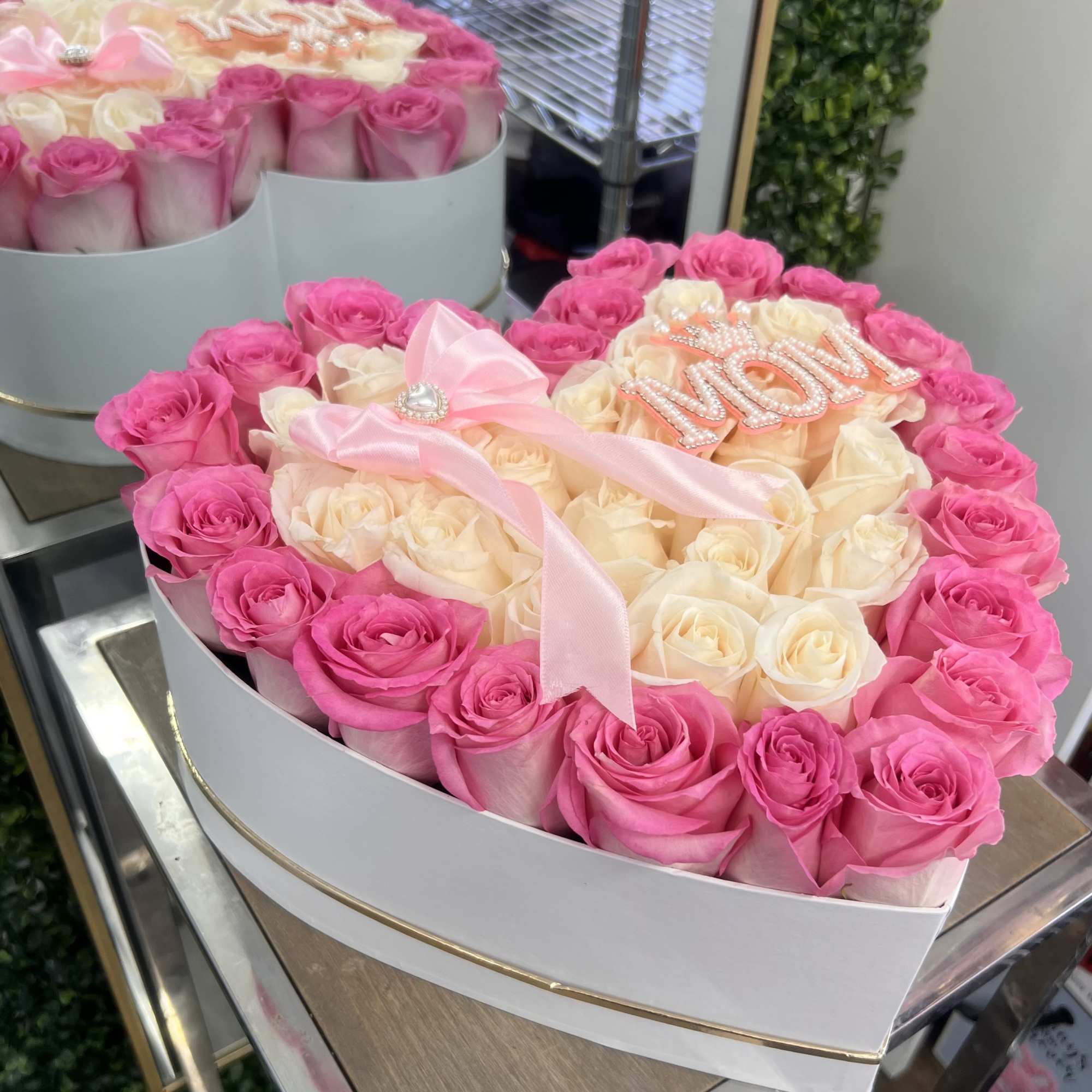 
A luxurious heart-shaped box featuring Pink And White roses, crafted to celebrate