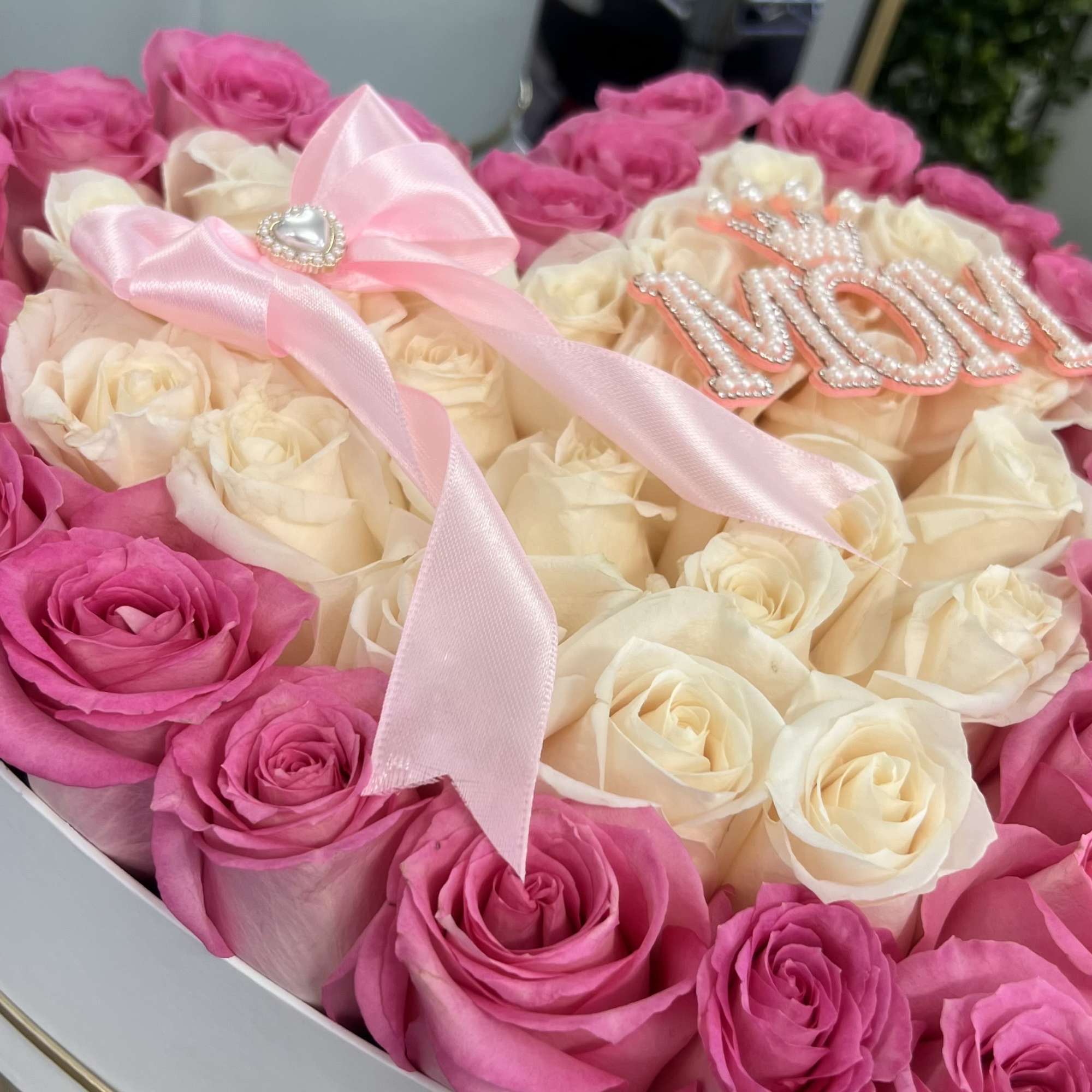 
A luxurious heart-shaped box featuring Pink And White roses, crafted to celebrate