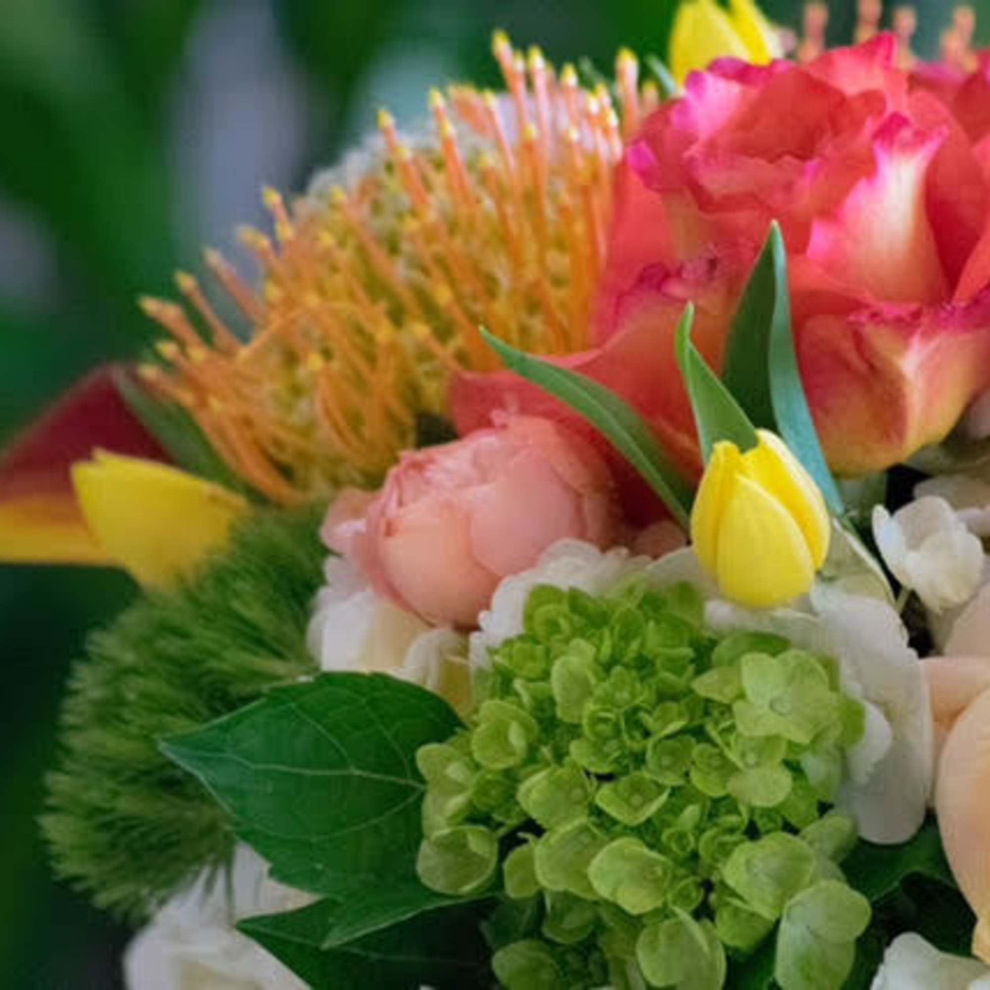 Colorful bouquet with pink, white, yellow, and green flowers