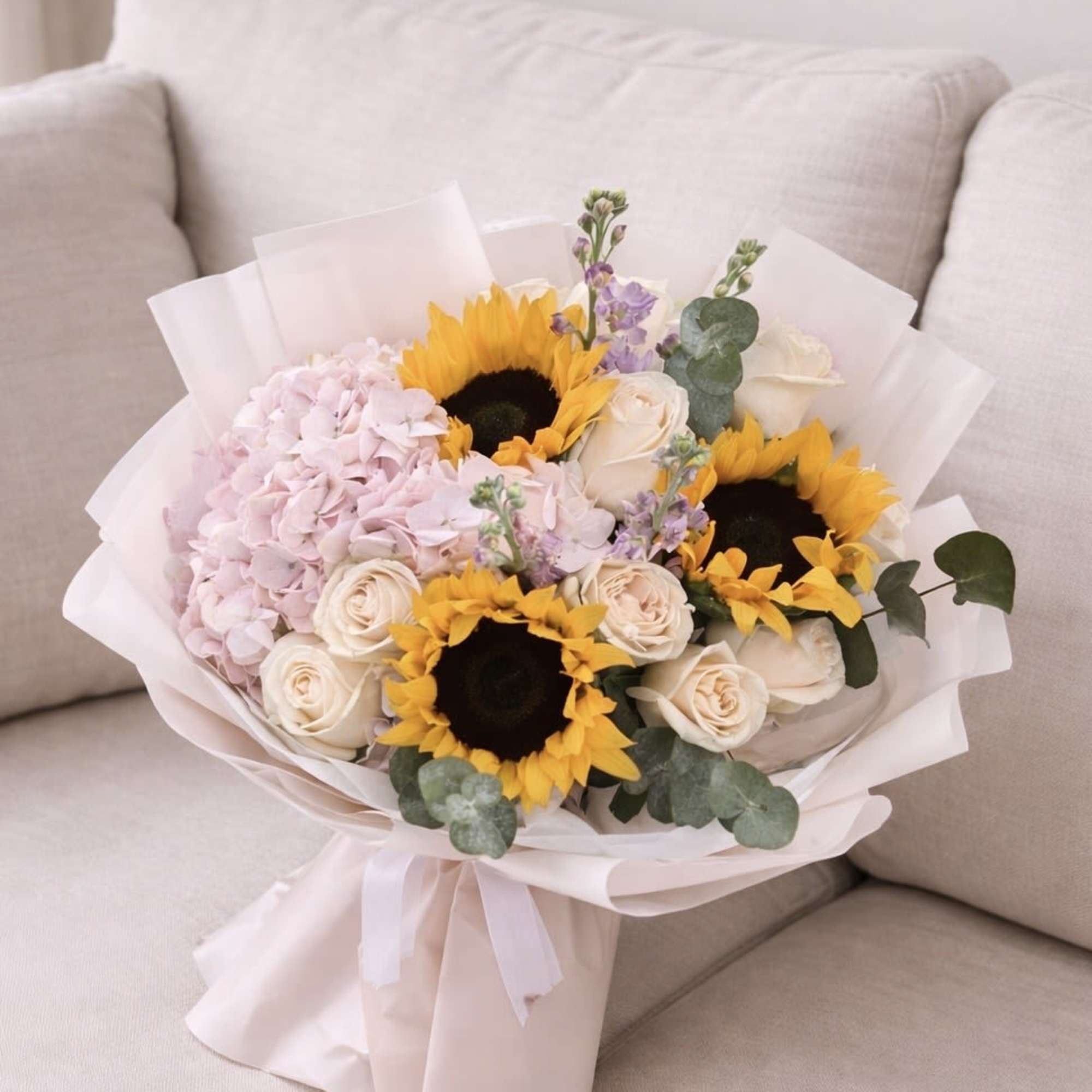 A soft and elegant bouquet that blends sunshine and romance. Featuring radiant