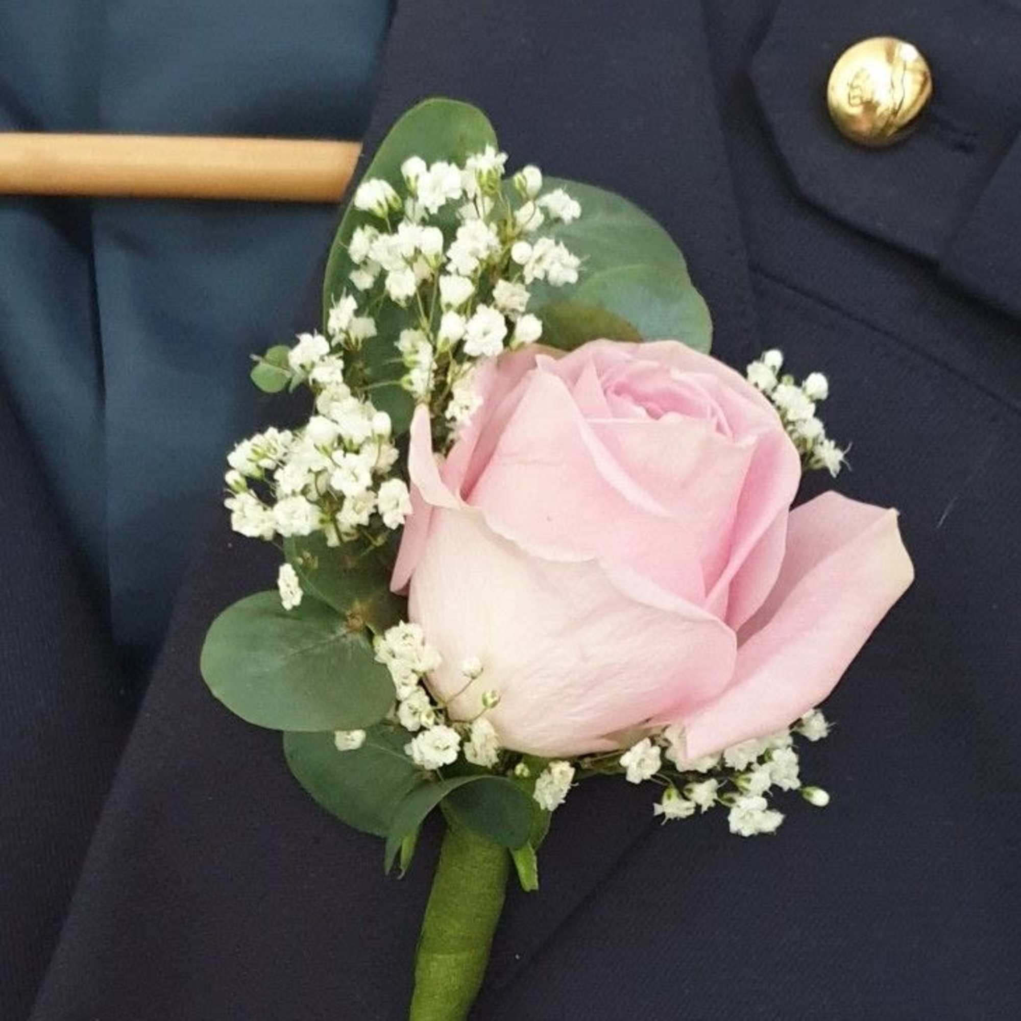 A classic red rose boutonni&egrave;re that compliments any suit. Perfect for prom