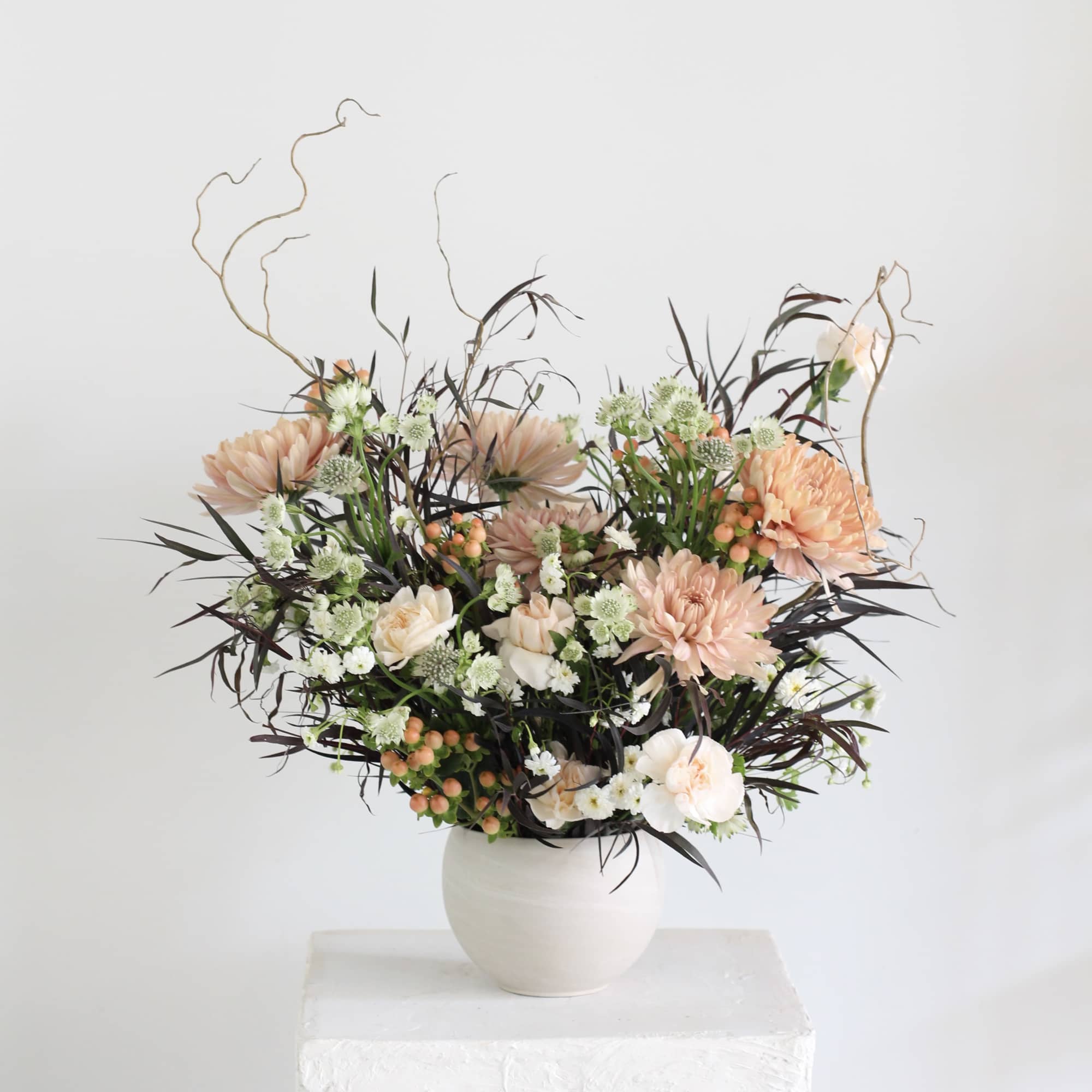 Our "Very Demure" arrangement offers a refreshing alternative to traditional florals. Featuring