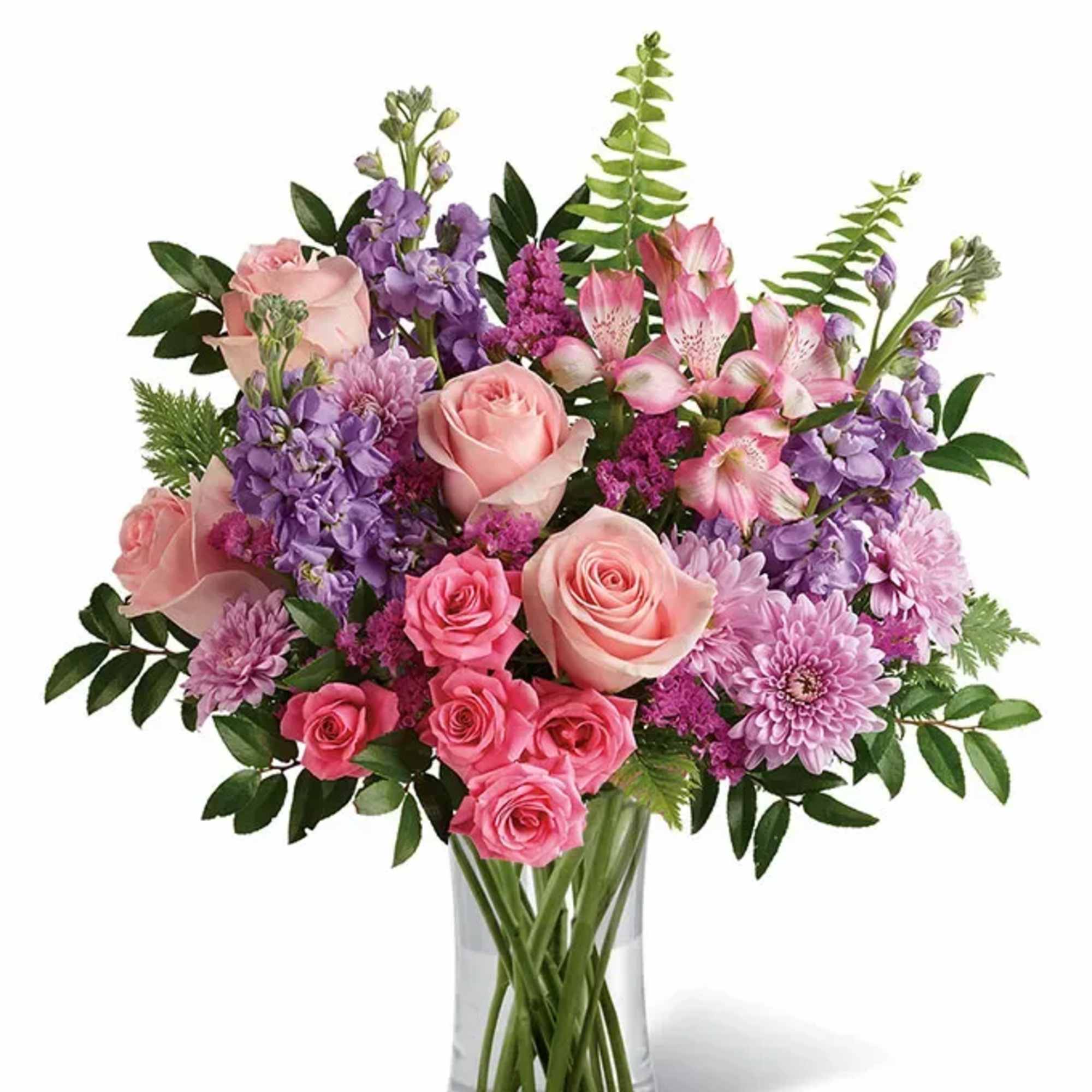 Pink and purple mixed bouquet in a clear glass vase