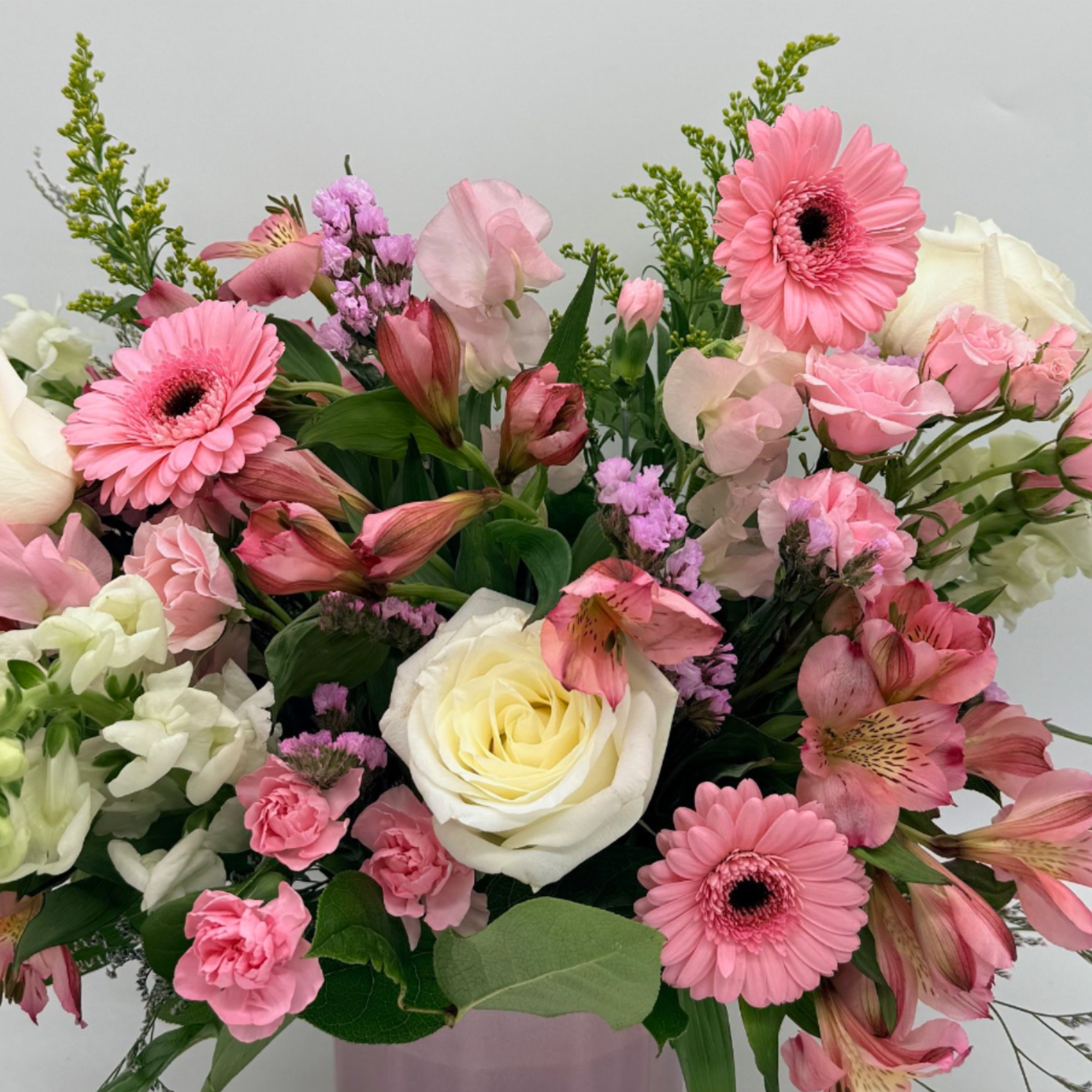 Pink and white mixed bouquet with gerbera daisies and roses