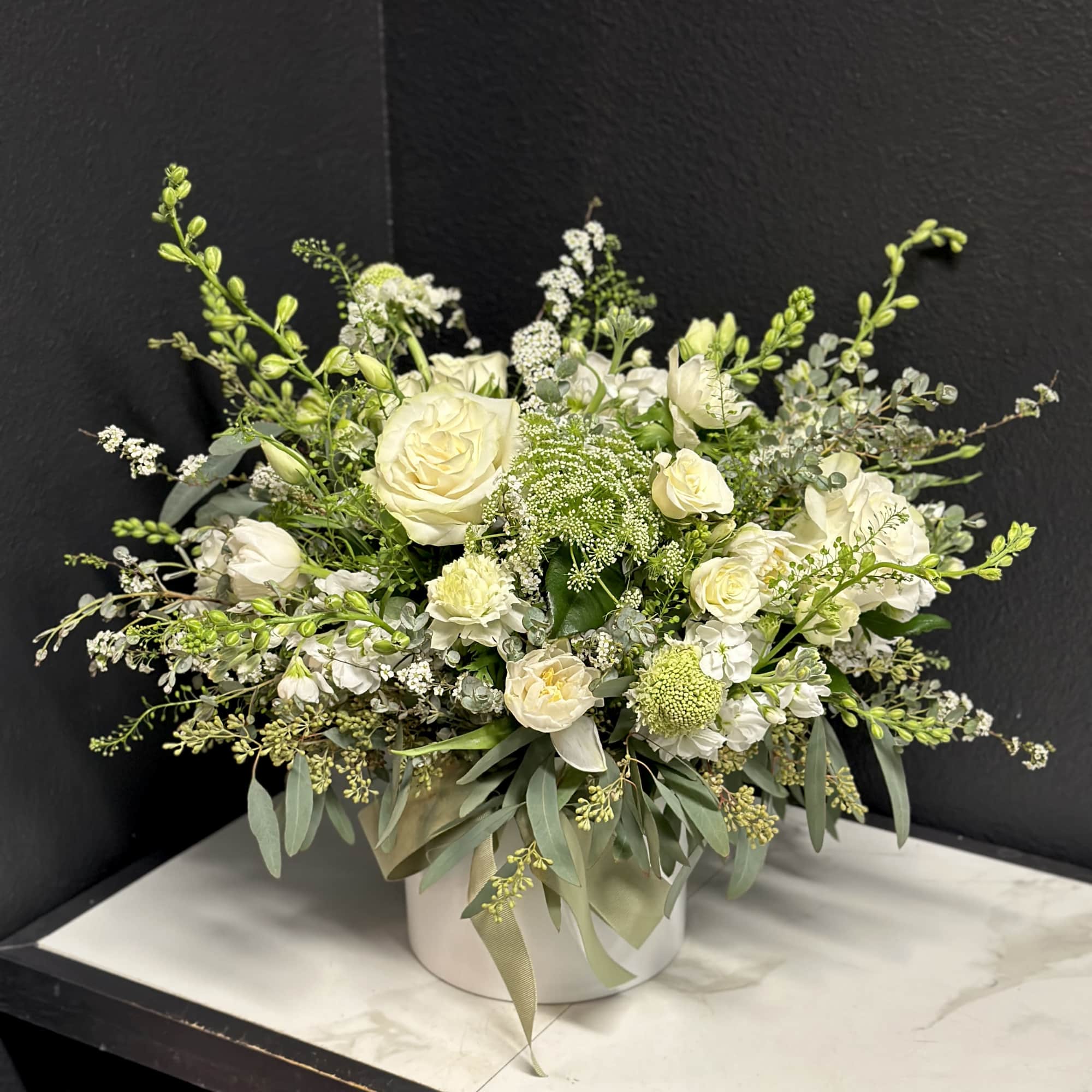 A loose and airy garden mix in creamy white blossoms. Delivered in