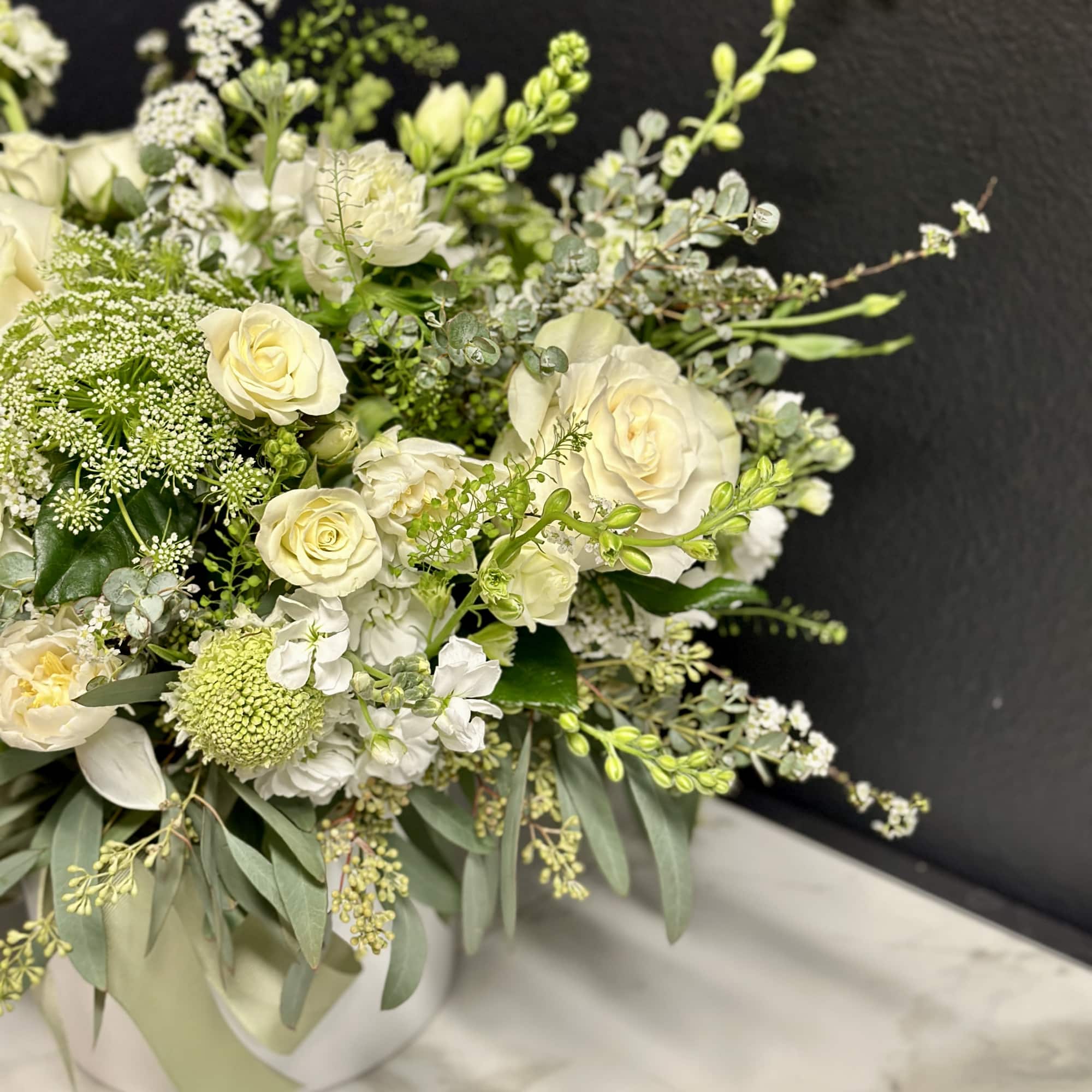 A loose and airy garden mix in creamy white blossoms. Delivered in