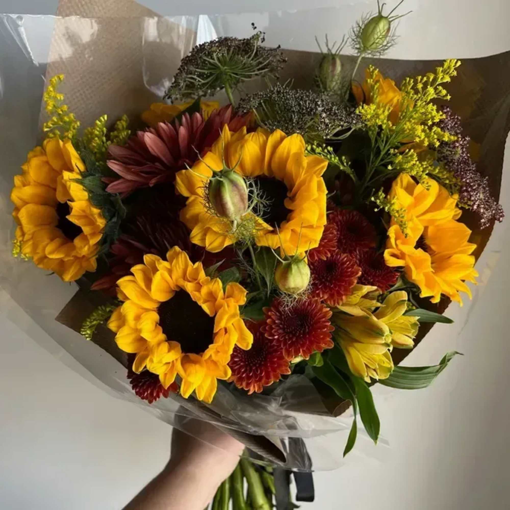 Our hand-tied bouquet features a curated mix of fresh seasonal blooms, artfully